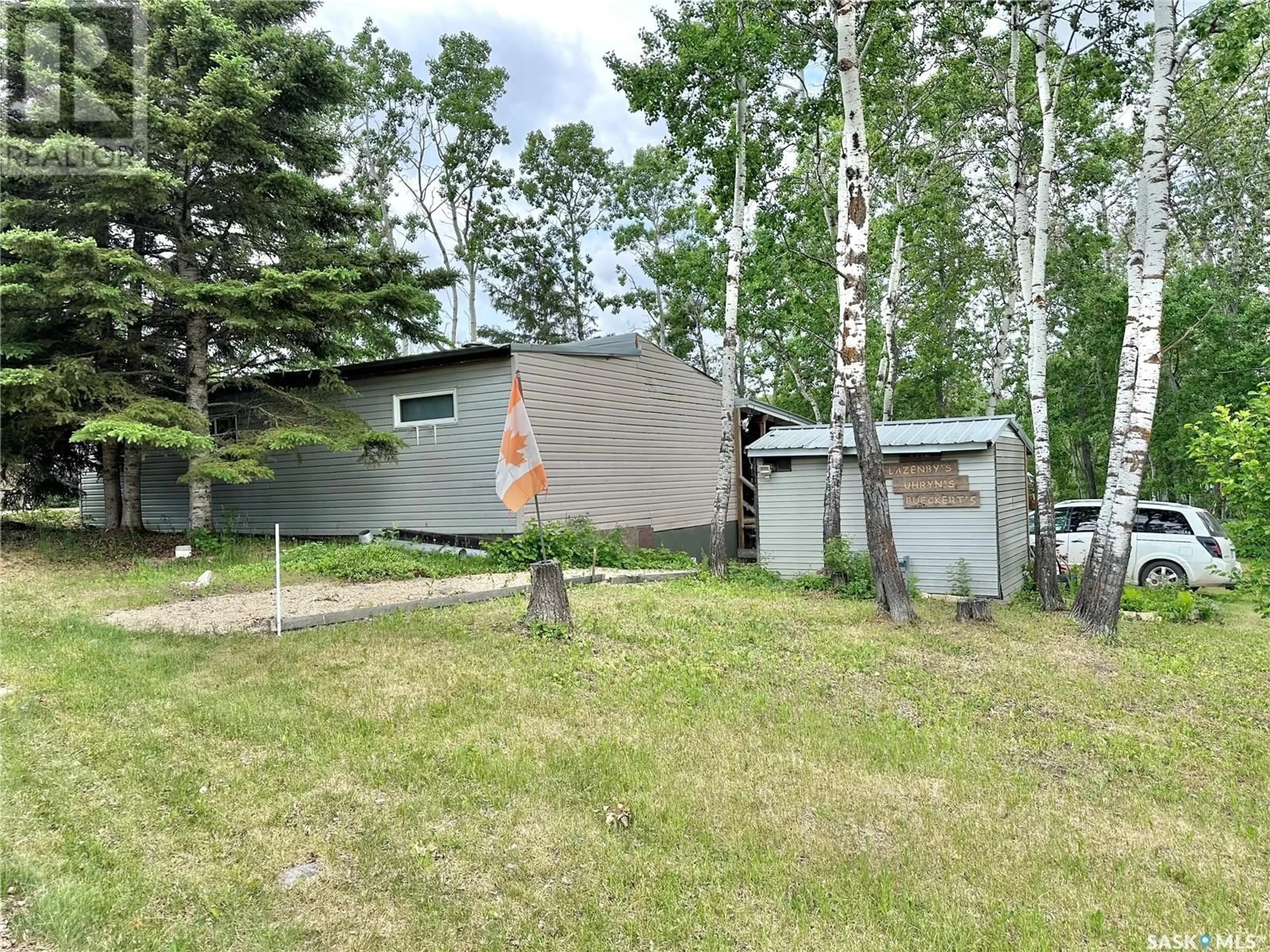 A pic from outside/outdoor area/front of a property/back of a property/a pic from drone, forest/trees view for 803 GARAND CRES, Iroquois Lake Saskatchewan S0J2G0