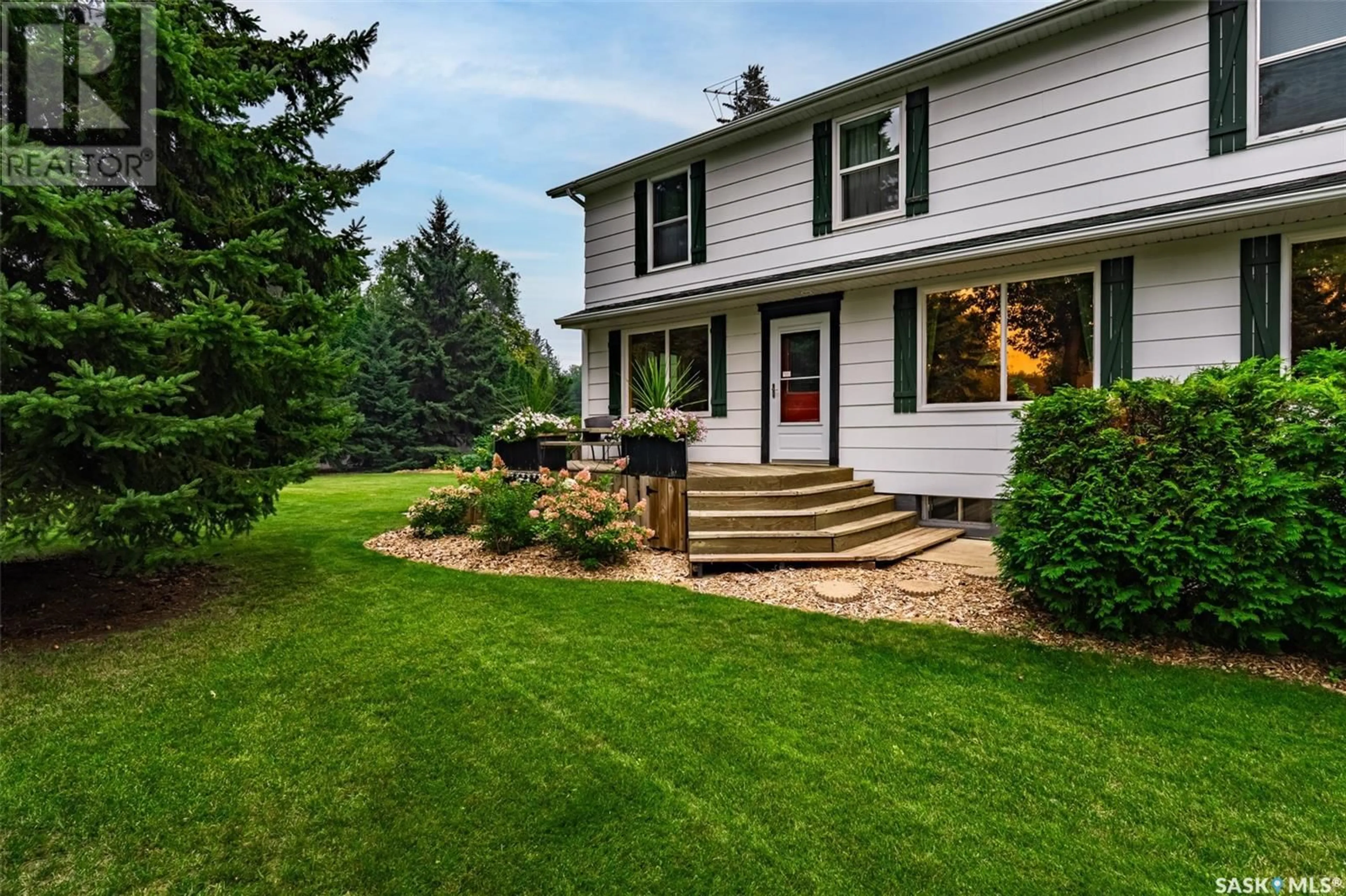 Home with vinyl exterior material, street for 1114 LANCASTER BOULEVARD, Saskatoon Saskatchewan S7M3V5