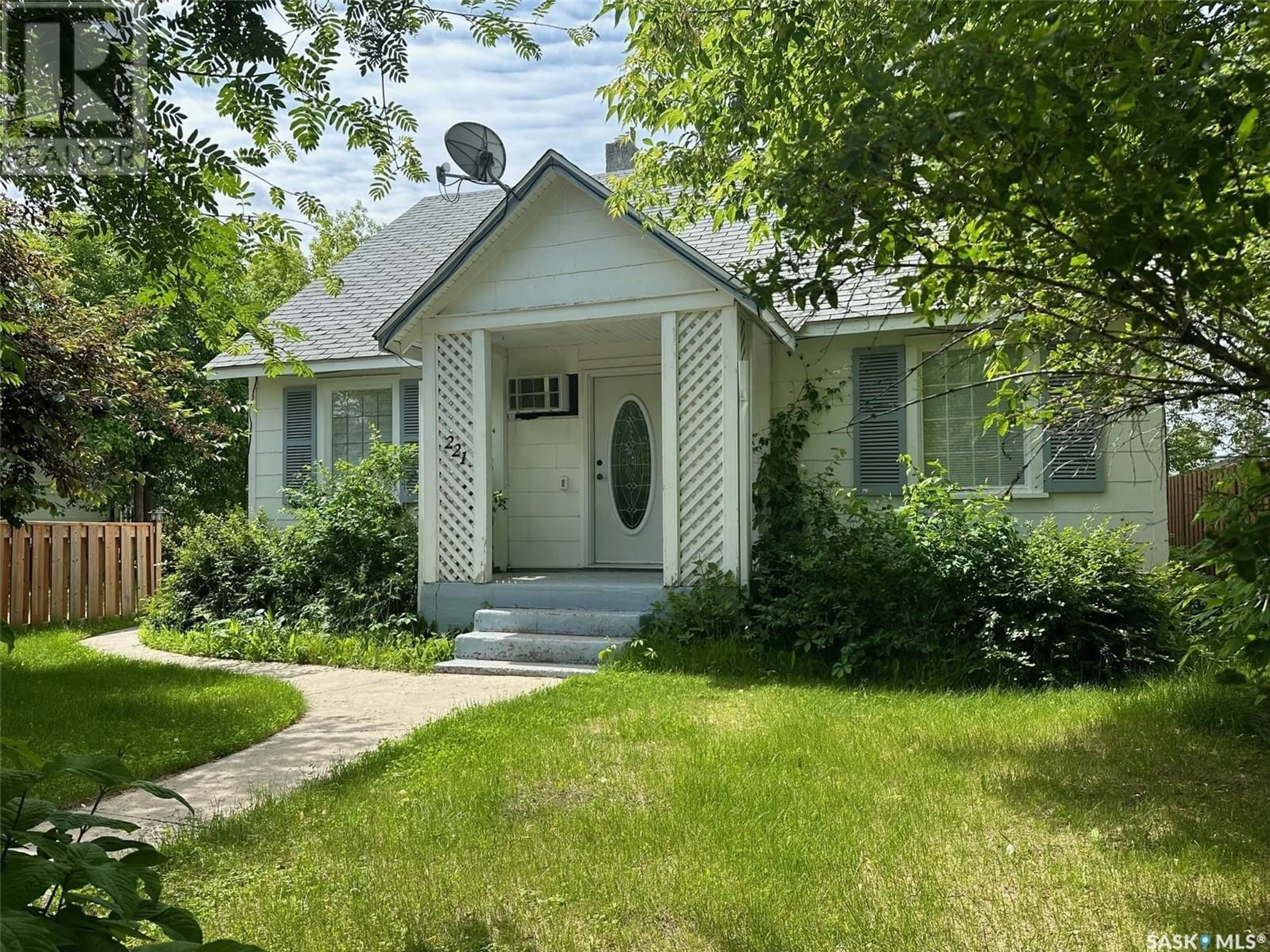 Home with vinyl exterior material, street for 221 MAIN STREET, Hudson Bay Saskatchewan S0E0Y0