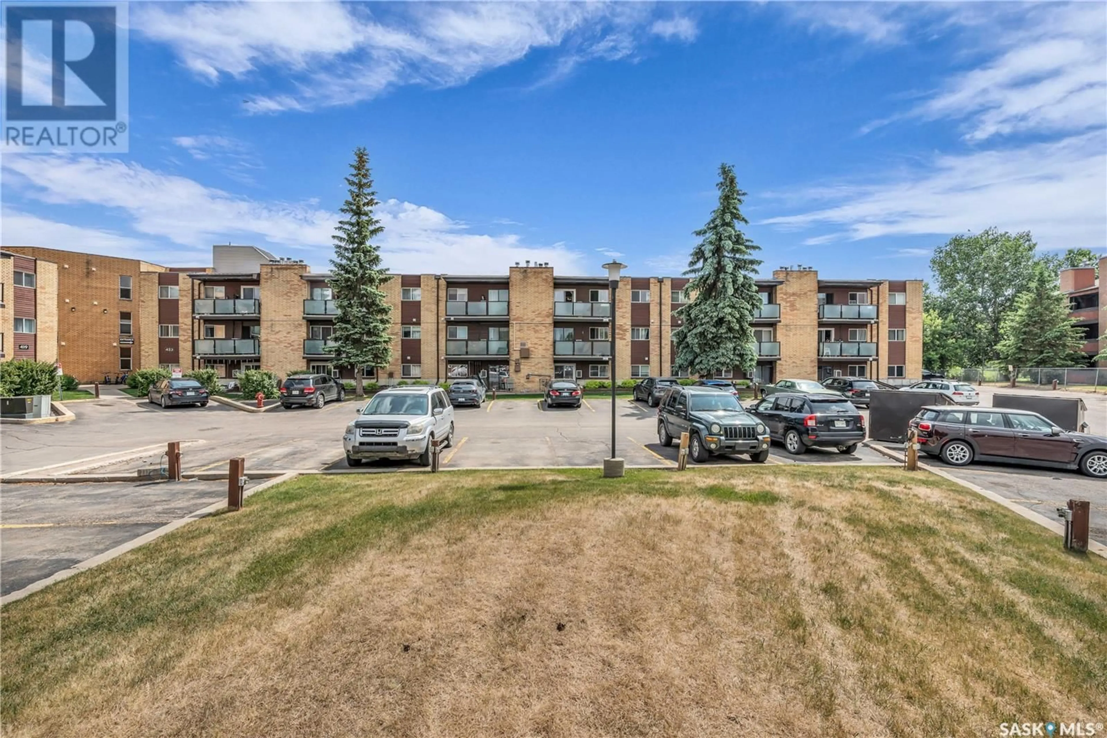 A pic from outside/outdoor area/front of a property/back of a property/a pic from drone, unknown for 307 423 TAIT CRESCENT, Saskatoon Saskatchewan S7H5L3