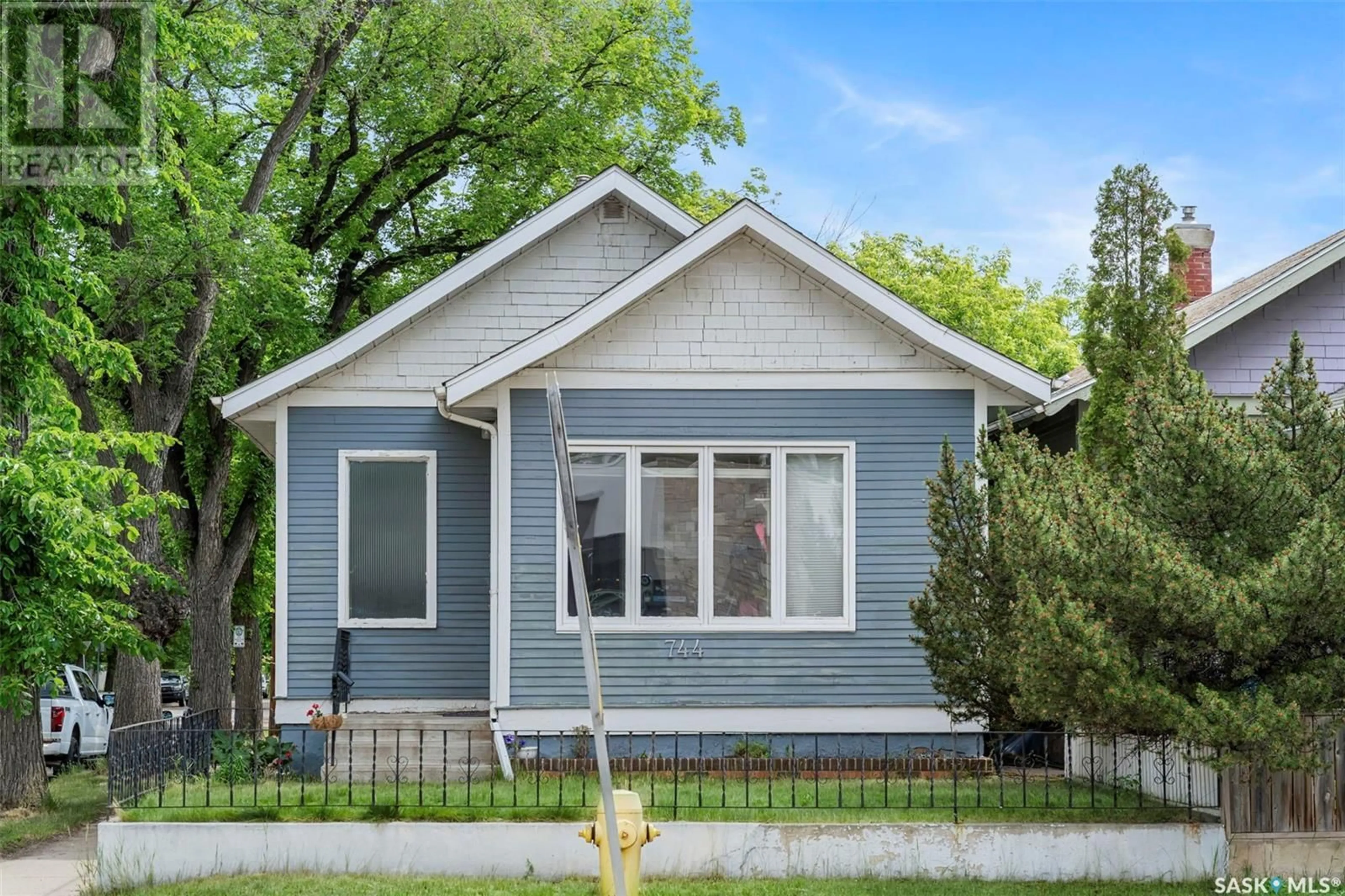 Home with vinyl exterior material, street for 744 7TH AVENUE, Saskatoon Saskatchewan S7K2V4