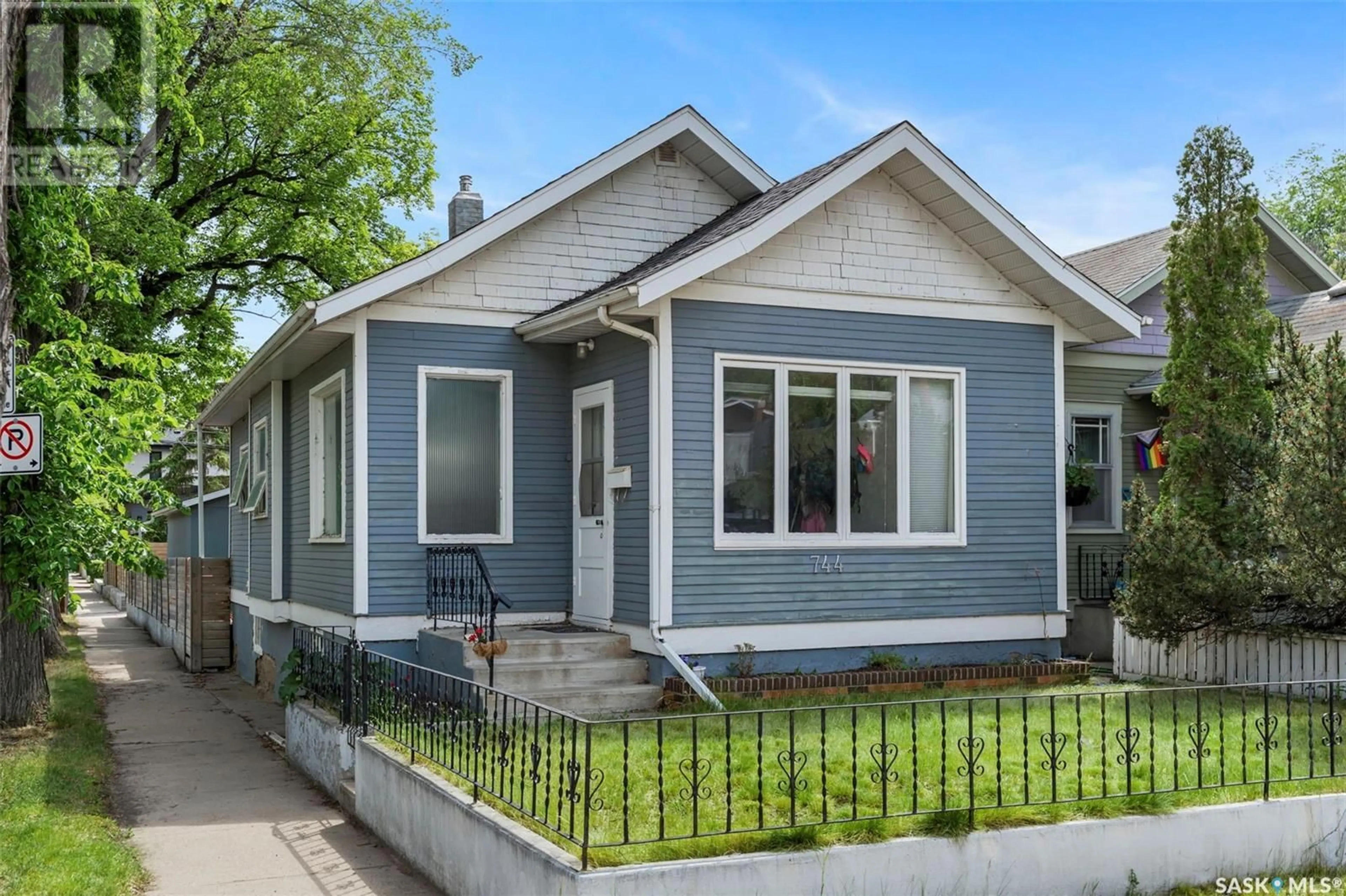 Home with vinyl exterior material, street for 744 7TH AVENUE, Saskatoon Saskatchewan S7K2V4