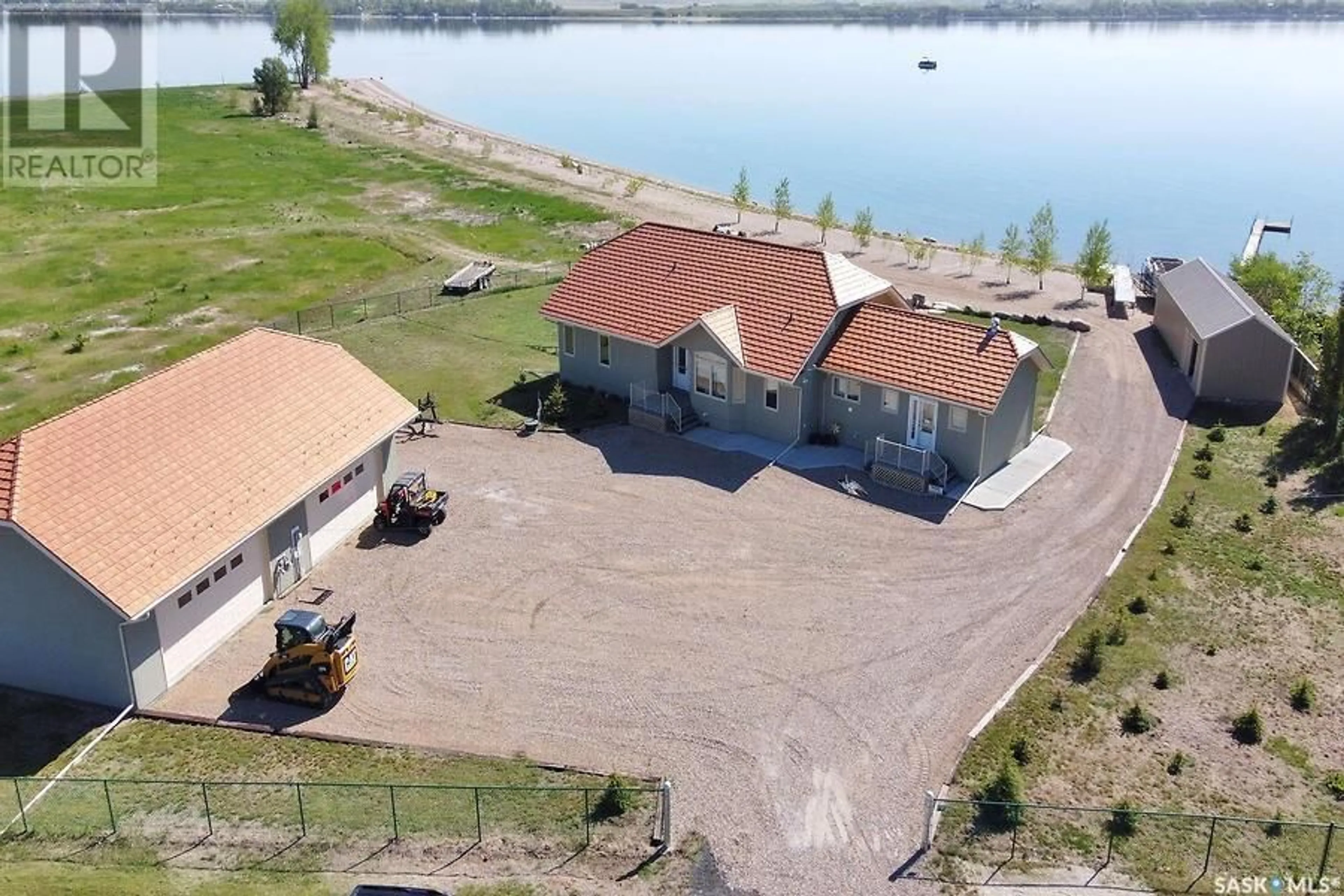 A pic from outside/outdoor area/front of a property/back of a property/a pic from drone, water/lake/river/ocean view for 400 LAKESHORE DRIVE, Wee Too Beach Saskatchewan S0G1C0
