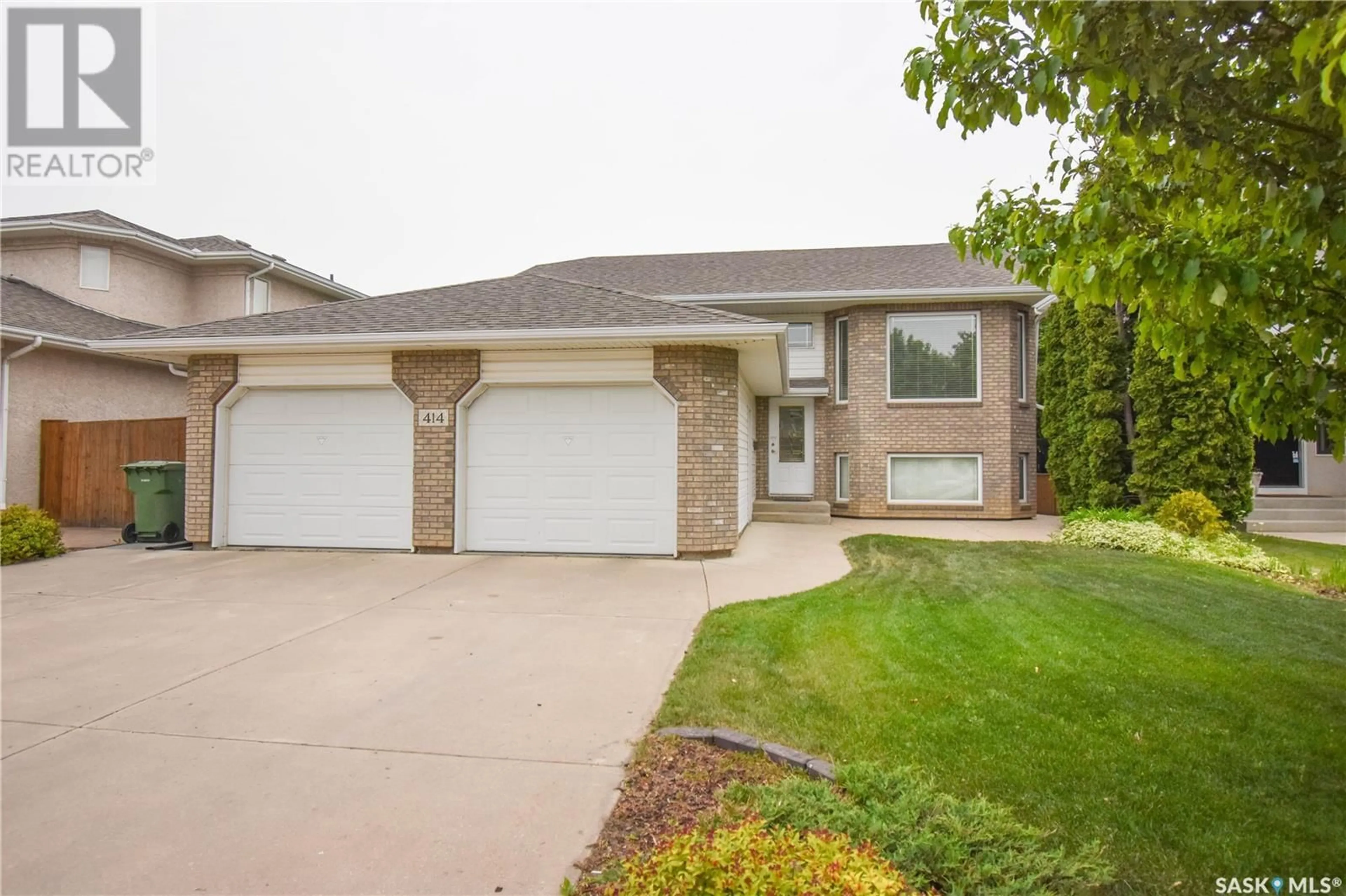 Home with vinyl exterior material, street for 414 BEERLING CRESCENT, Saskatoon Saskatchewan S7S1K5