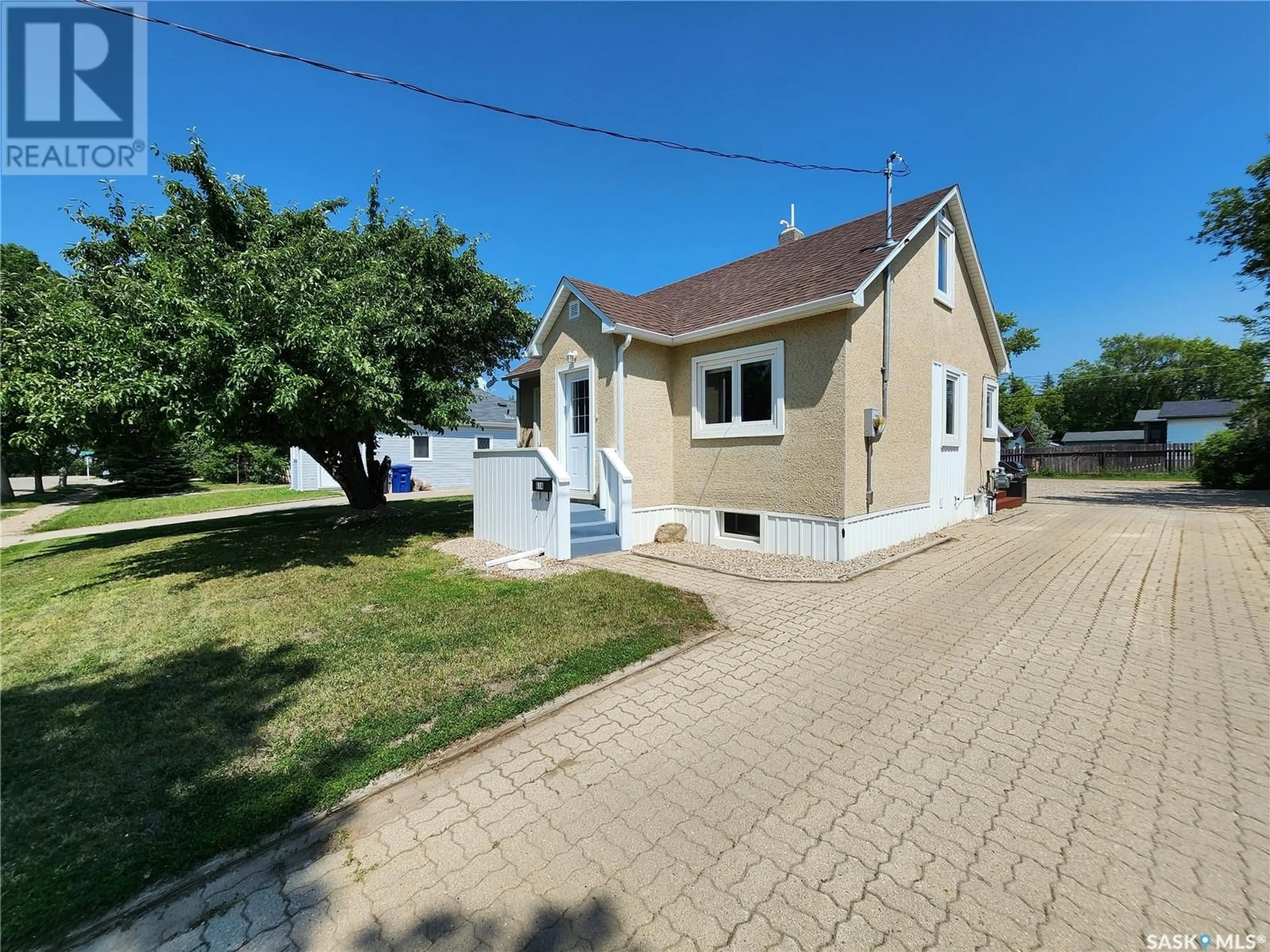 A pic from outside/outdoor area/front of a property/back of a property/a pic from drone, street for 614 3RD STREET, Weyburn Saskatchewan S4H2E1