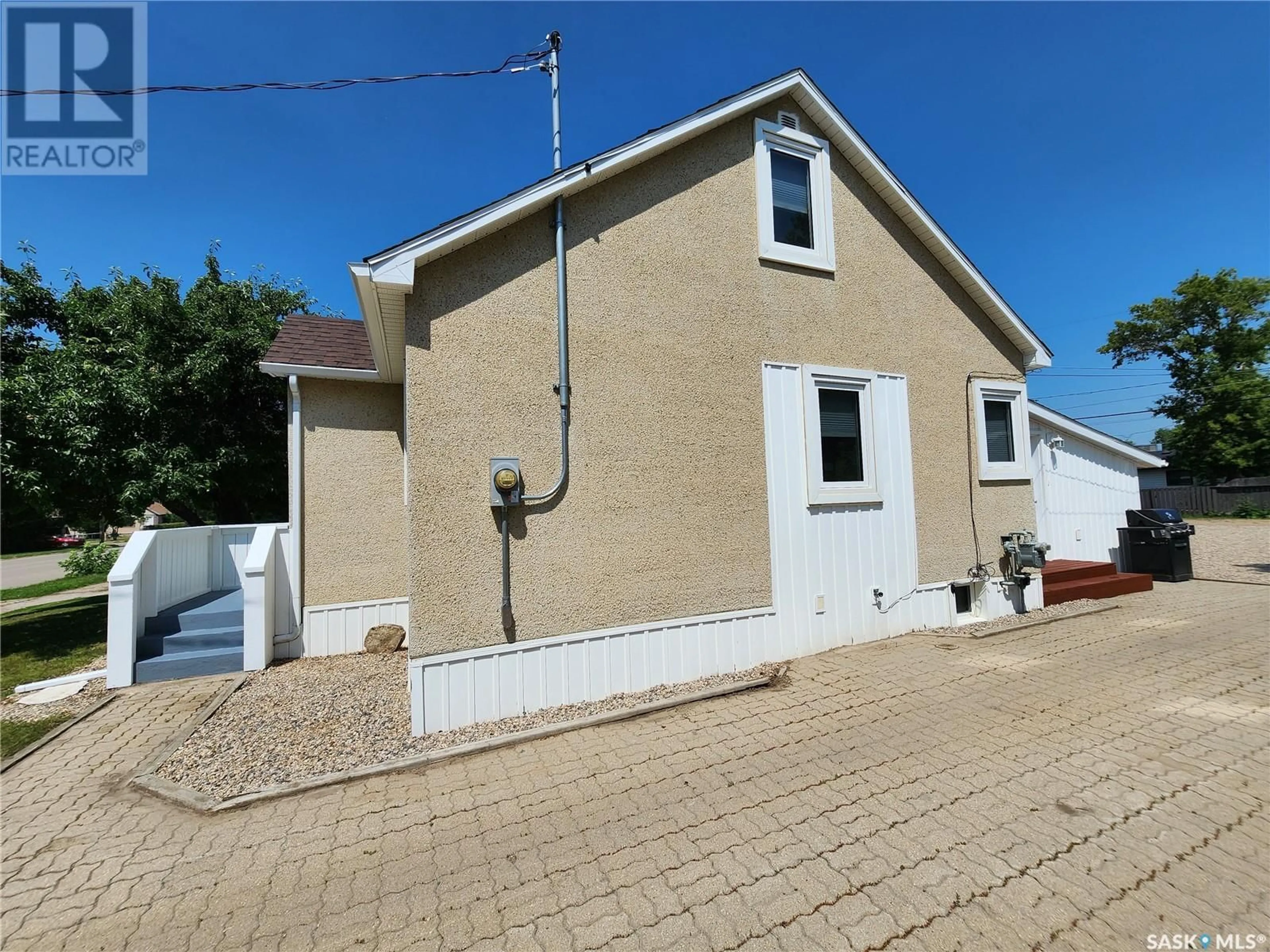 A pic from outside/outdoor area/front of a property/back of a property/a pic from drone, street for 614 3RD STREET, Weyburn Saskatchewan S4H2E1