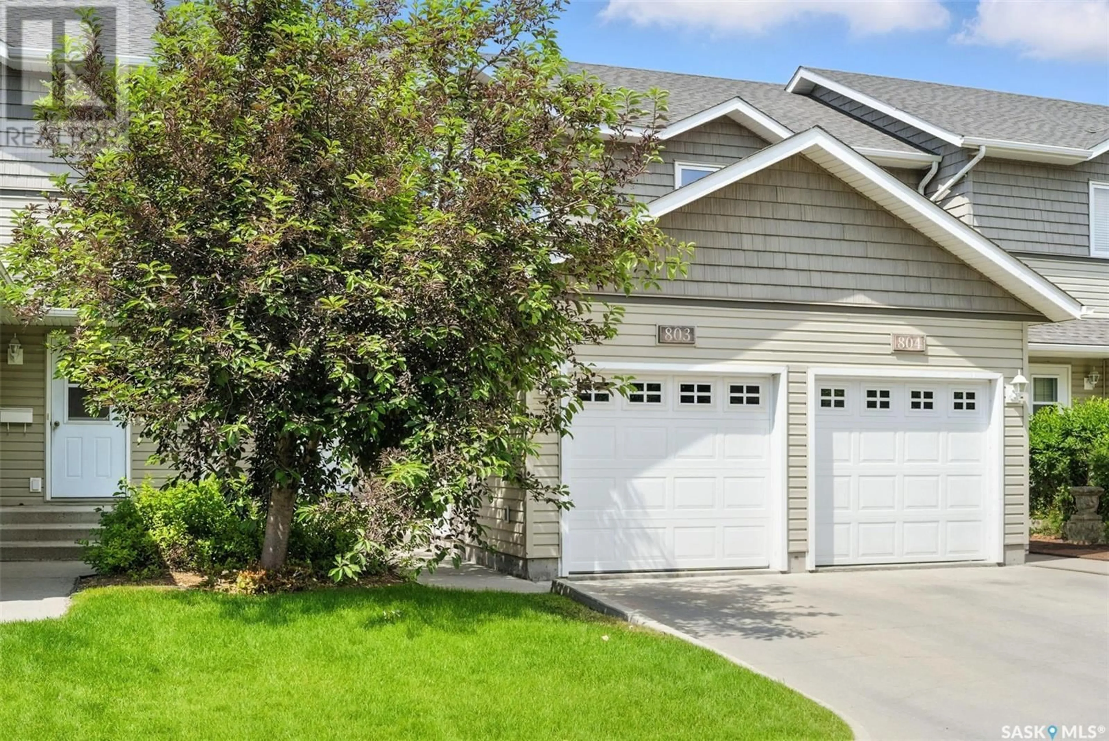 Home with vinyl exterior material, street for 715 - 803 HART ROAD, Saskatoon Saskatchewan S7M3Y7