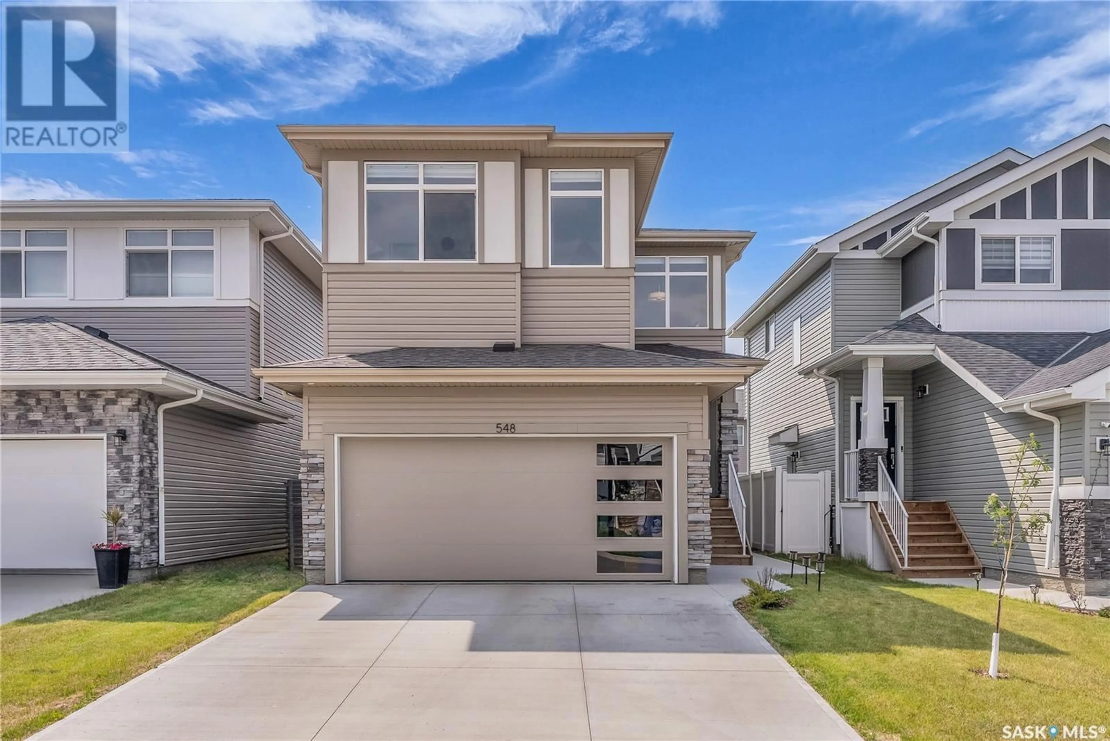 Home with vinyl exterior material, street for 548 SCHMEISER AVENUE, Saskatoon Saskatchewan S7V1N5