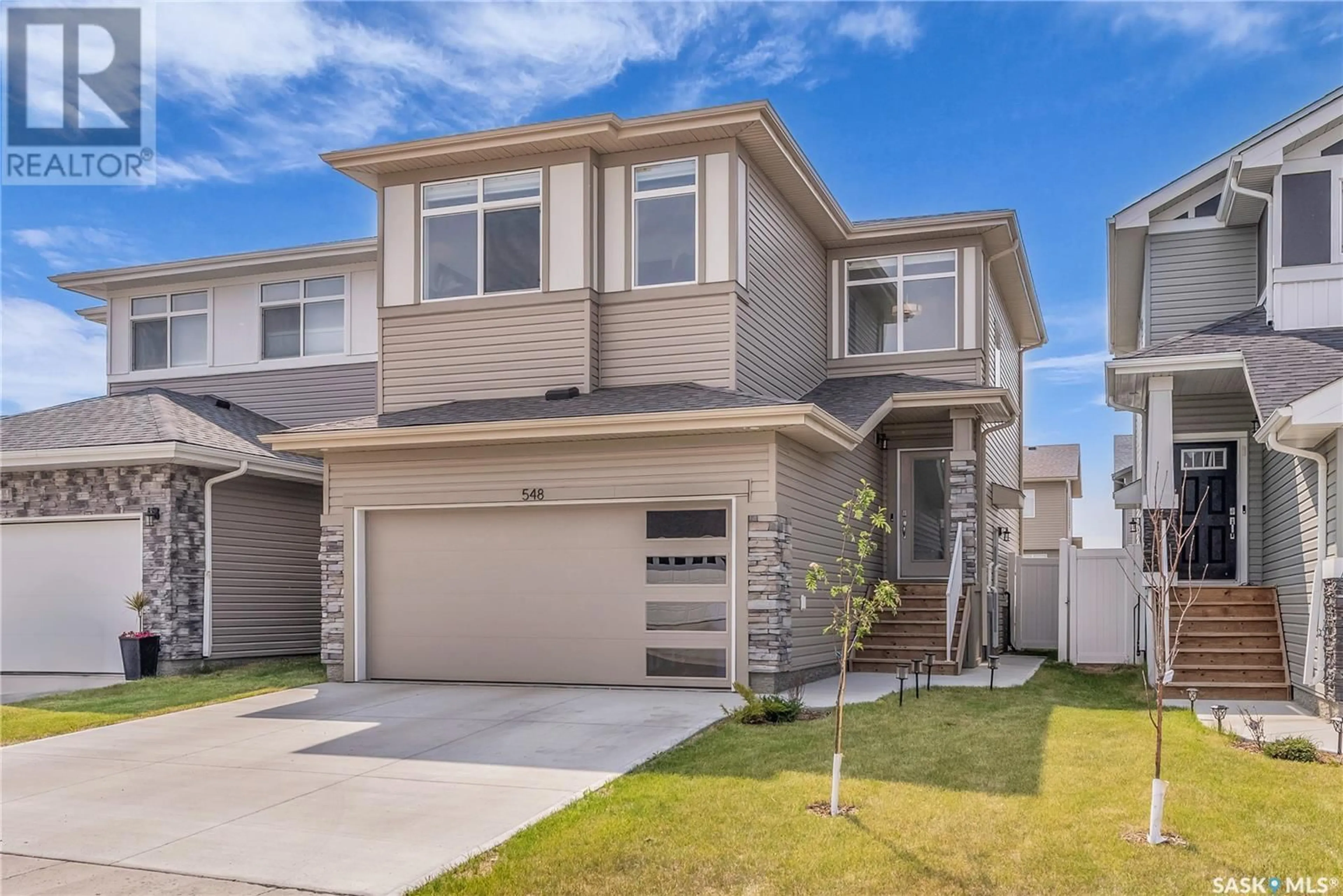 Home with vinyl exterior material, street for 548 SCHMEISER AVENUE, Saskatoon Saskatchewan S7V1N5