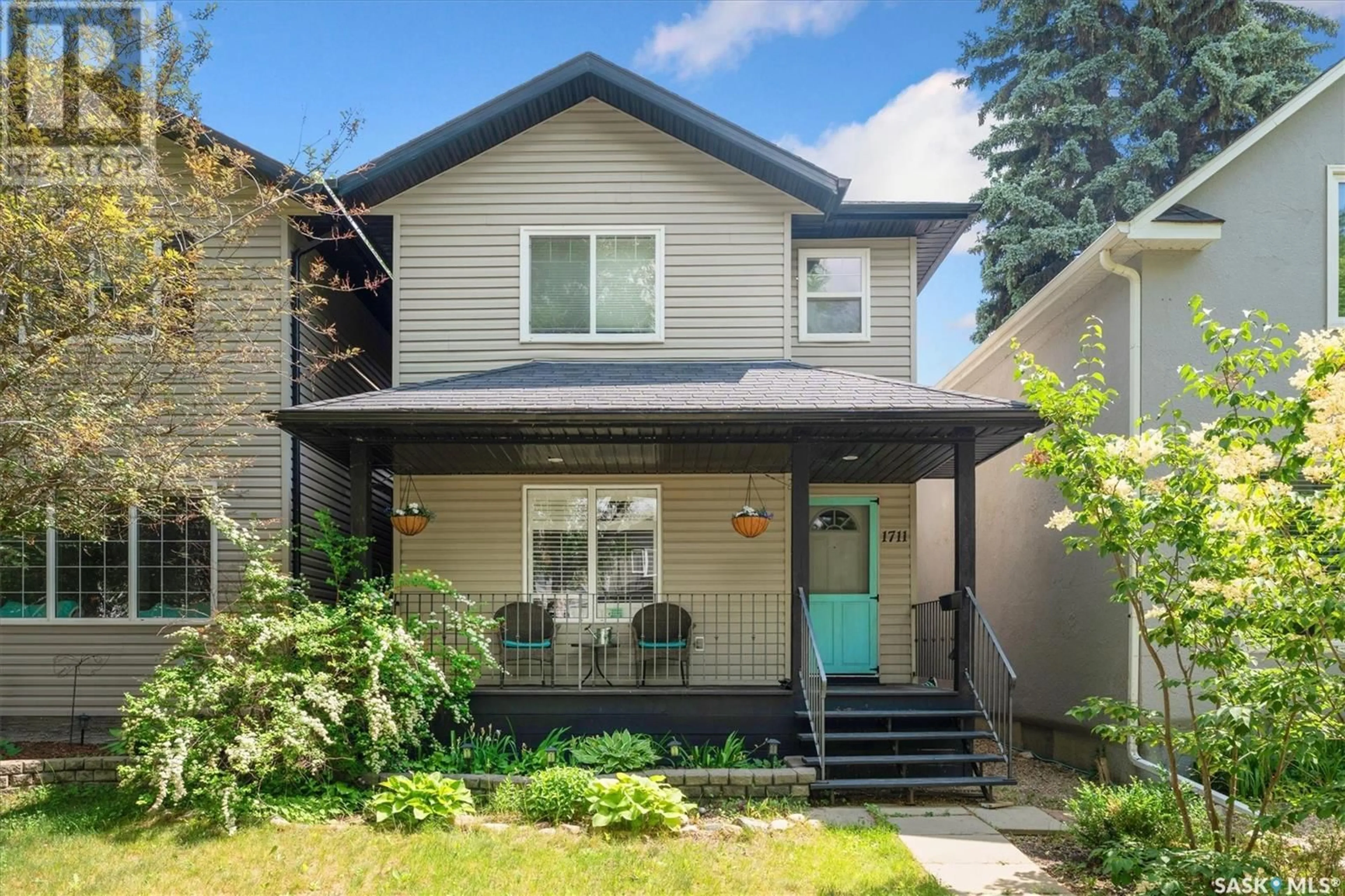 Home with vinyl exterior material, street for 1711 COY AVENUE, Saskatoon Saskatchewan S7M0H8