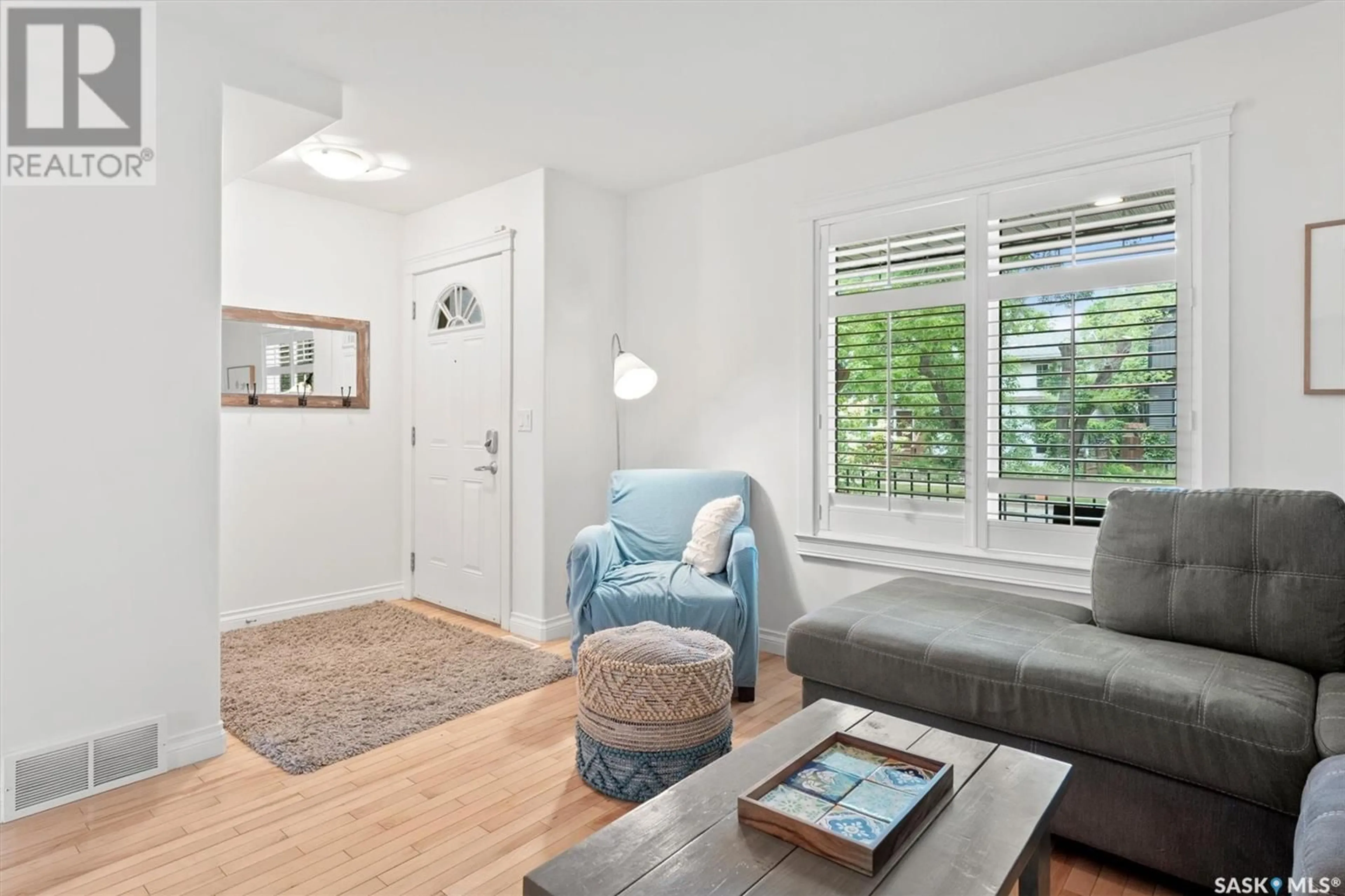 Living room with furniture, wood/laminate floor for 1711 COY AVENUE, Saskatoon Saskatchewan S7M0H8