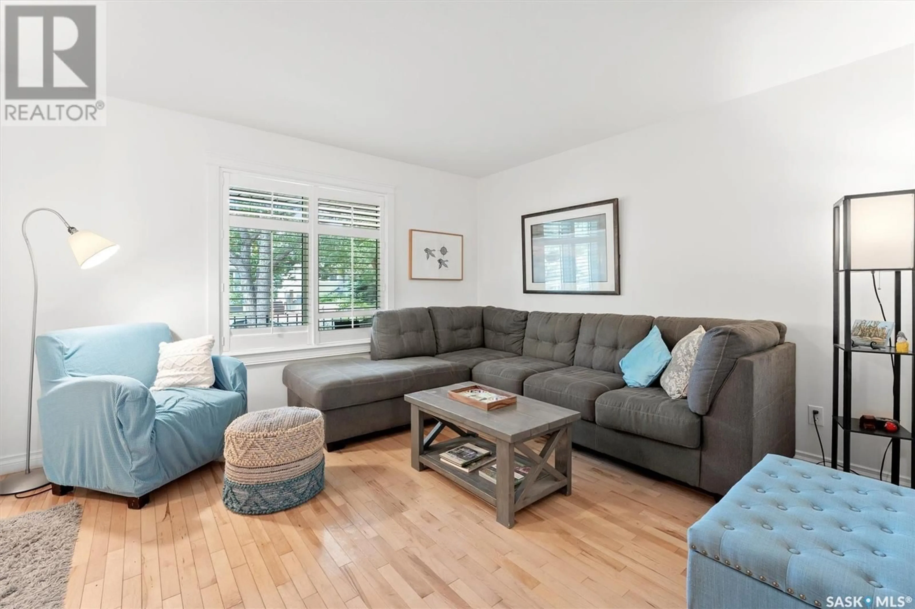 Living room with furniture, wood/laminate floor for 1711 COY AVENUE, Saskatoon Saskatchewan S7M0H8