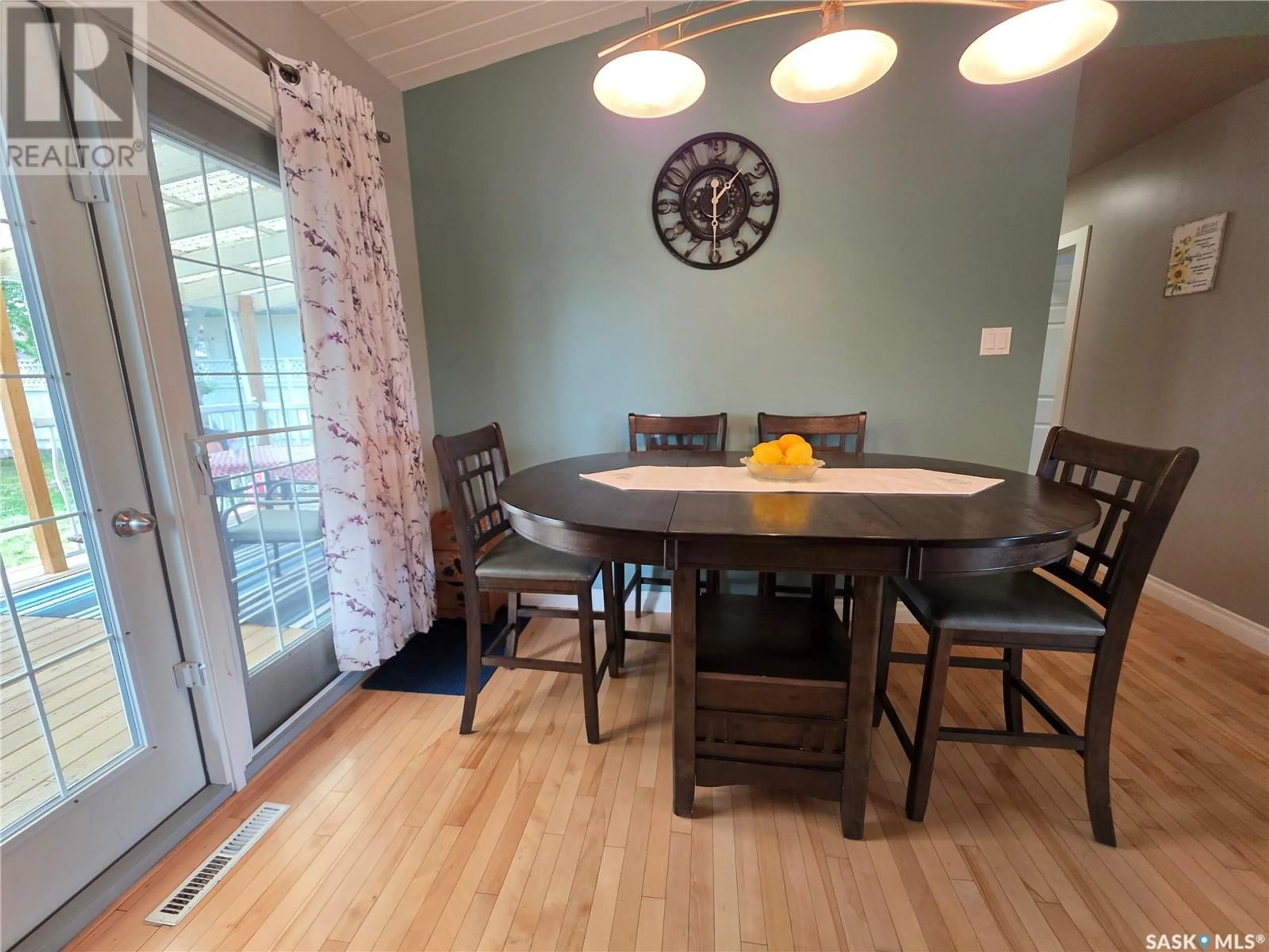 Dining room, wood/laminate floor for 1000 9TH AVENUE, Swift Current Saskatchewan S9H2S9