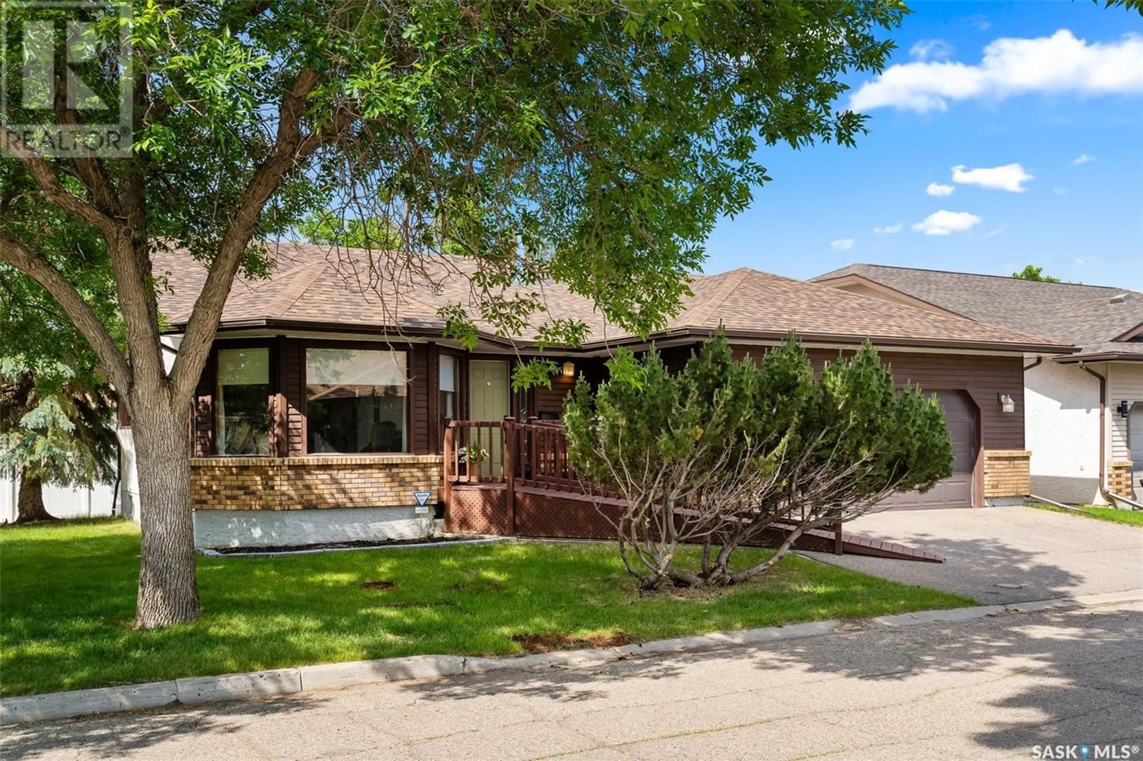 Home with vinyl exterior material, street for 80 GREENSBORO DRIVE, Regina Saskatchewan S4S7G1