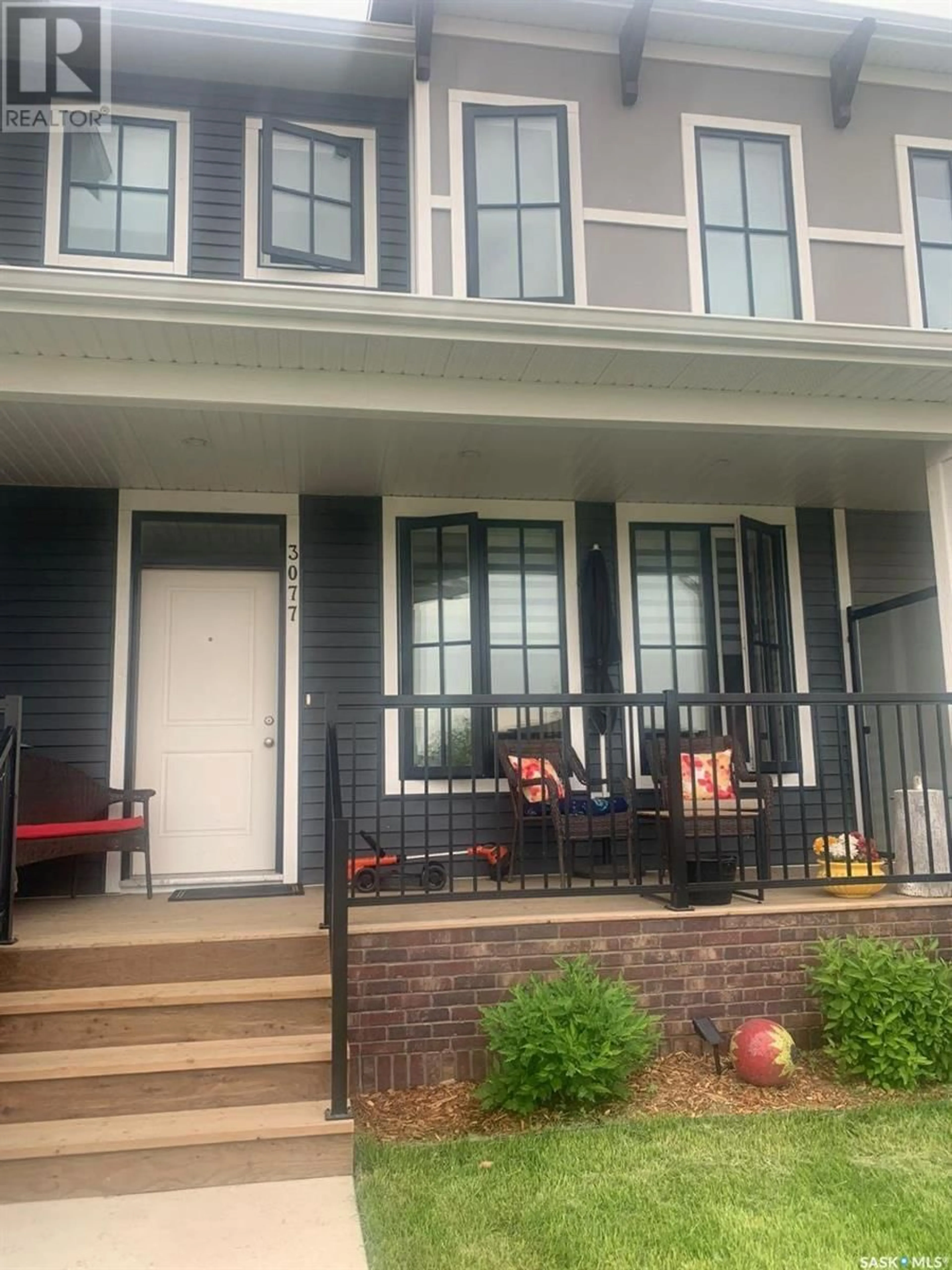 Home with vinyl exterior material, street for 3077 BRIGHTON COMMON, Saskatoon Saskatchewan S7V0E5