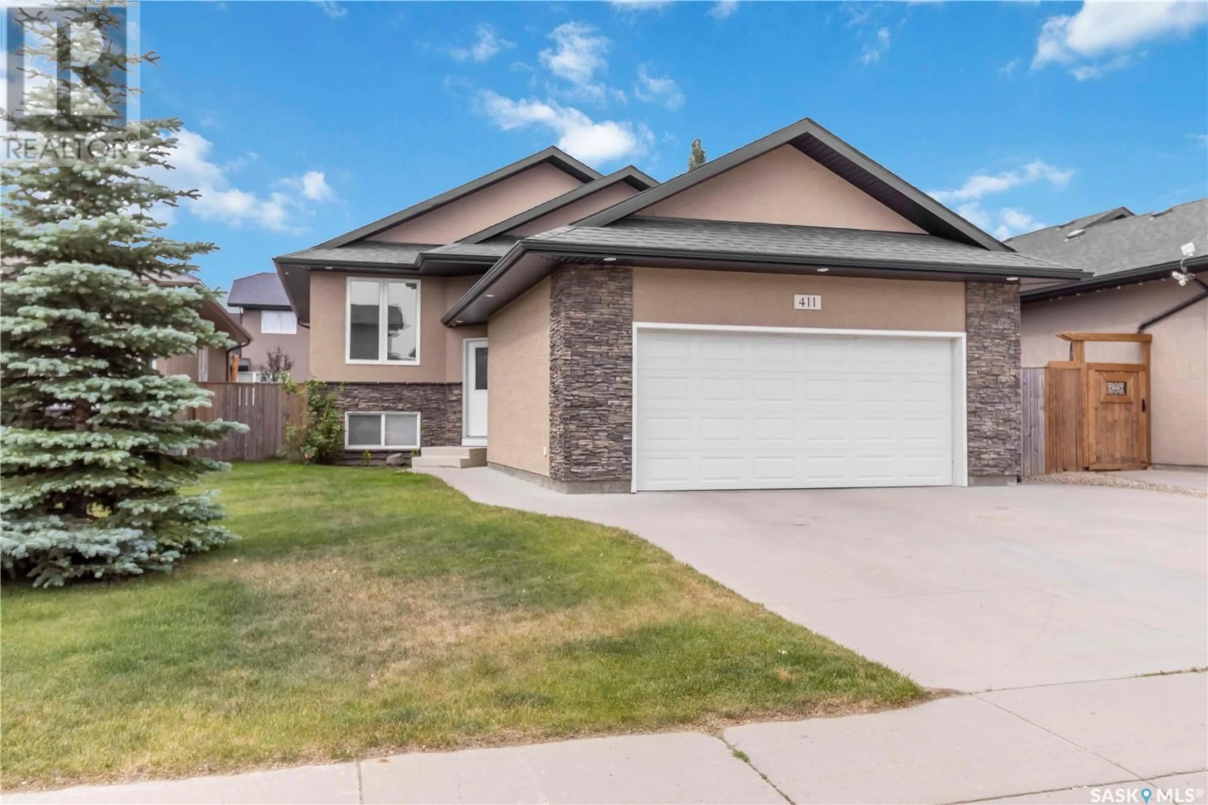 Home with brick exterior material, street for 411 REMPEL LANE, Saskatoon Saskatchewan S7T0J3
