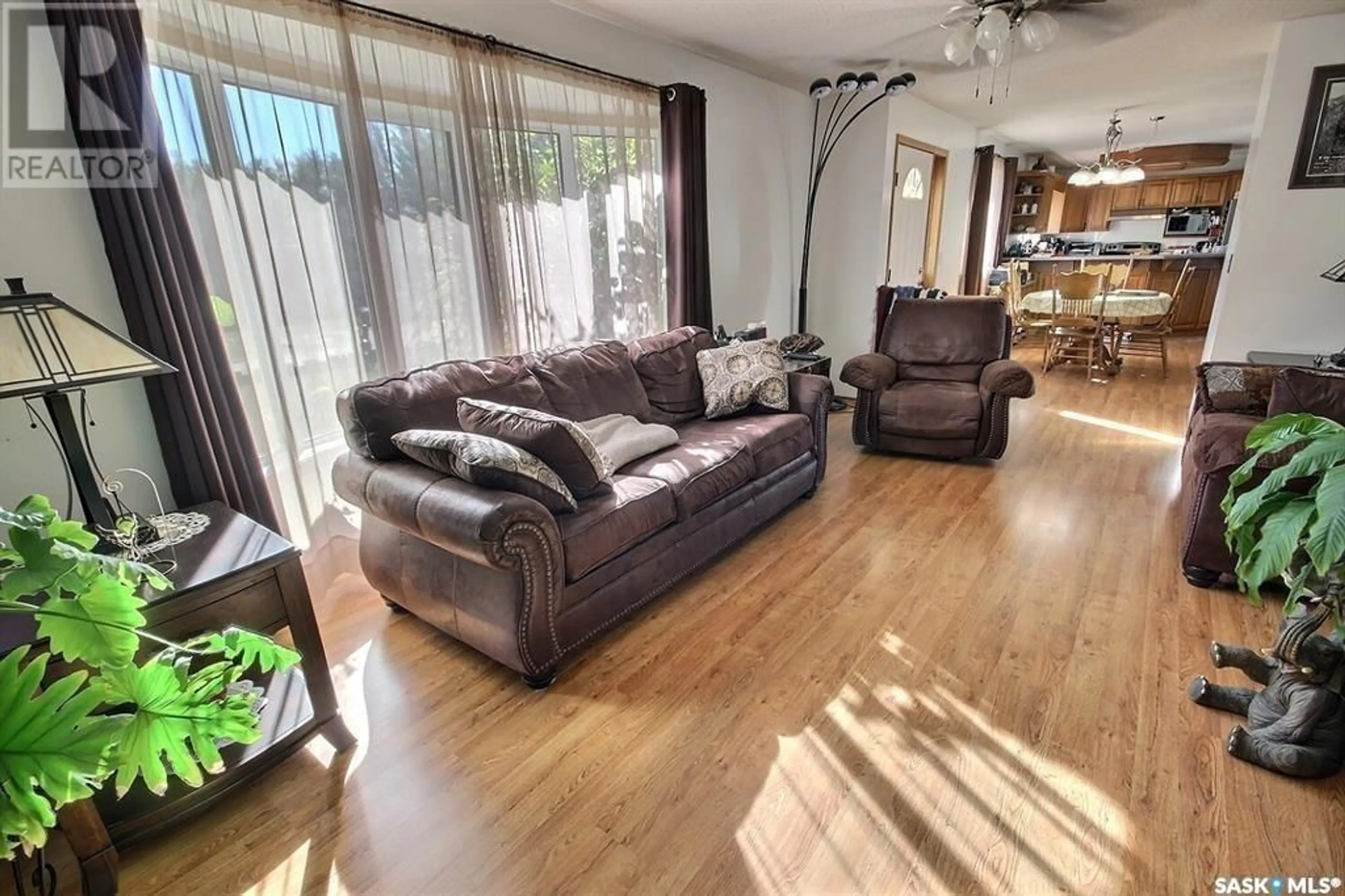 Living room with furniture, wood/laminate floor for 506 LALIBERTE AVENUE, Beauval Saskatchewan S0M0G0