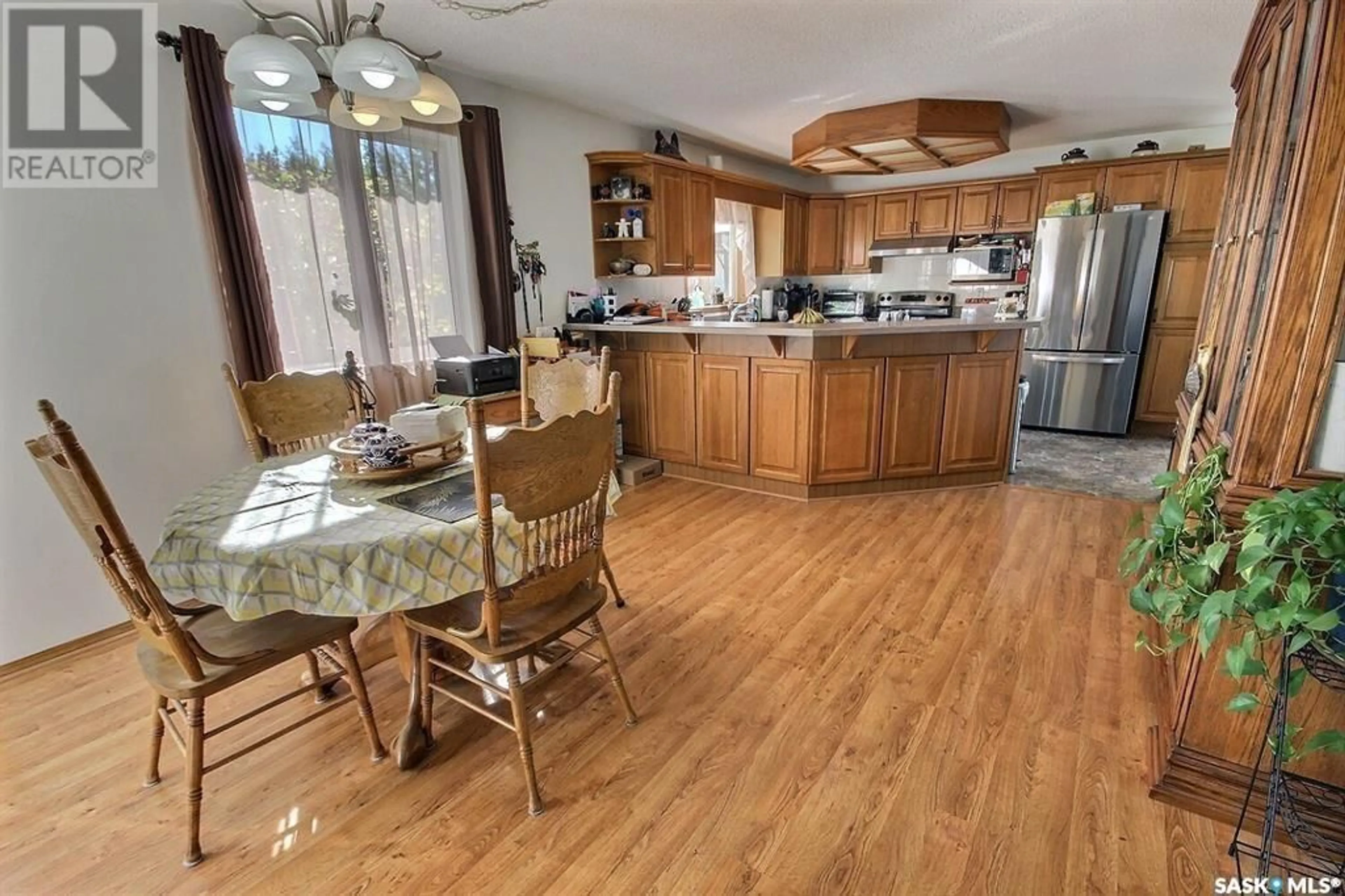 Open concept kitchen, wood/laminate floor for 506 LALIBERTE AVENUE, Beauval Saskatchewan S0M0G0