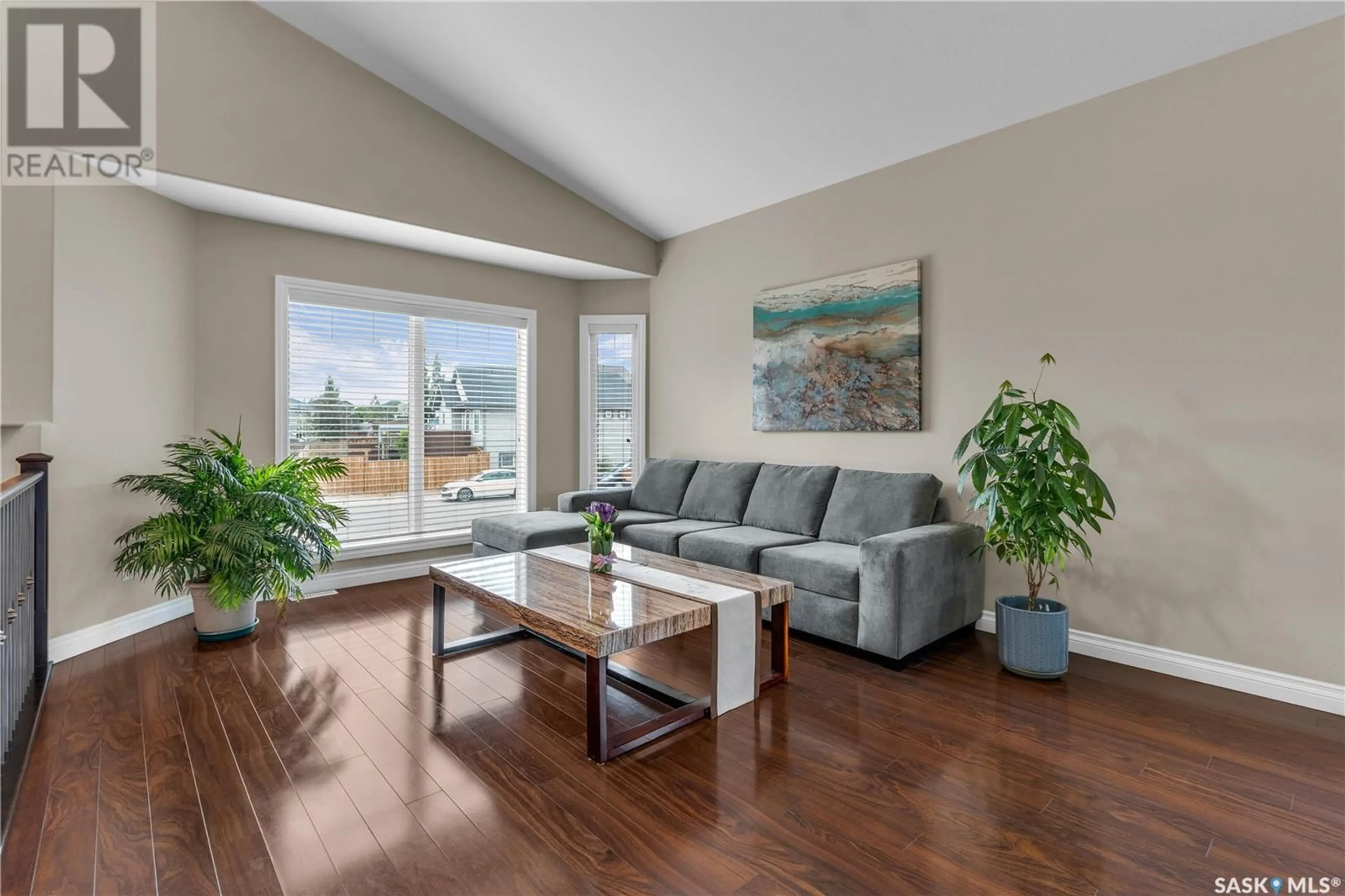 Living room with furniture, wood/laminate floor for 554 SENICK CRESCENT, Saskatoon Saskatchewan S7T0P6