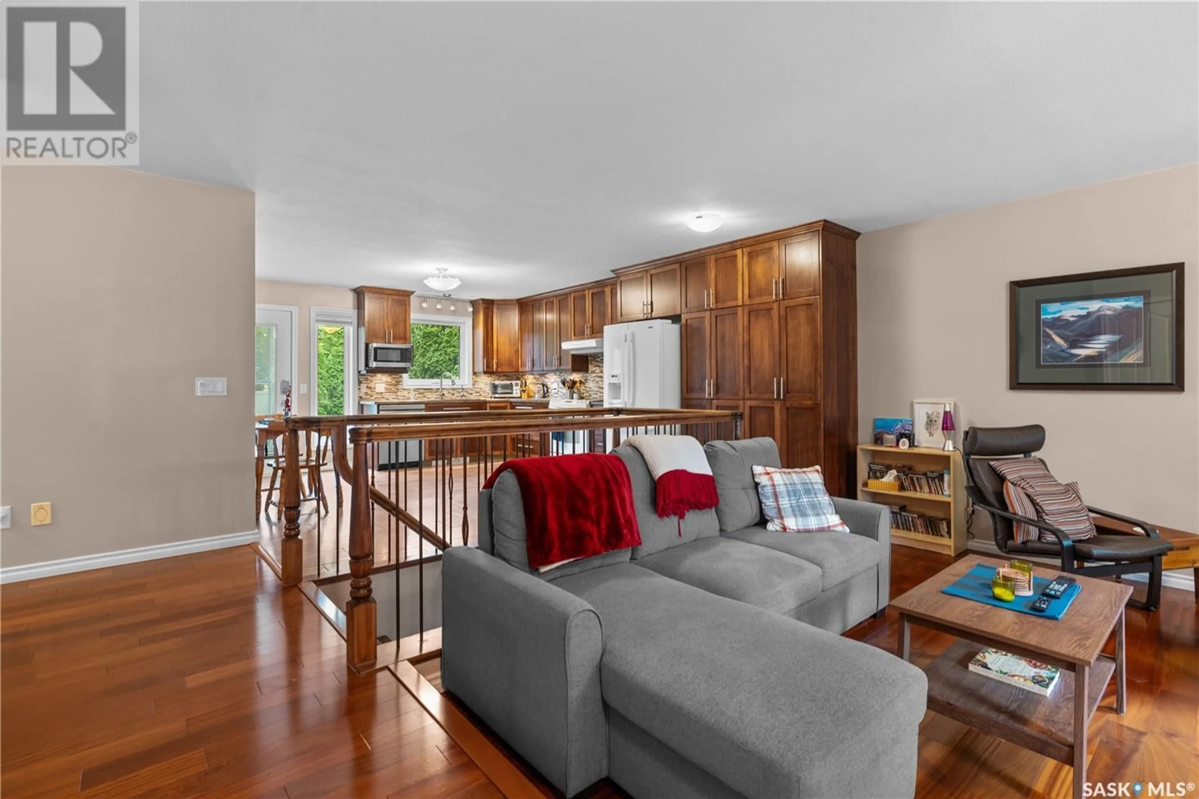 Living room with furniture, wood/laminate floor for 315 BLACK DRIVE, Regina Saskatchewan S4X2Z6