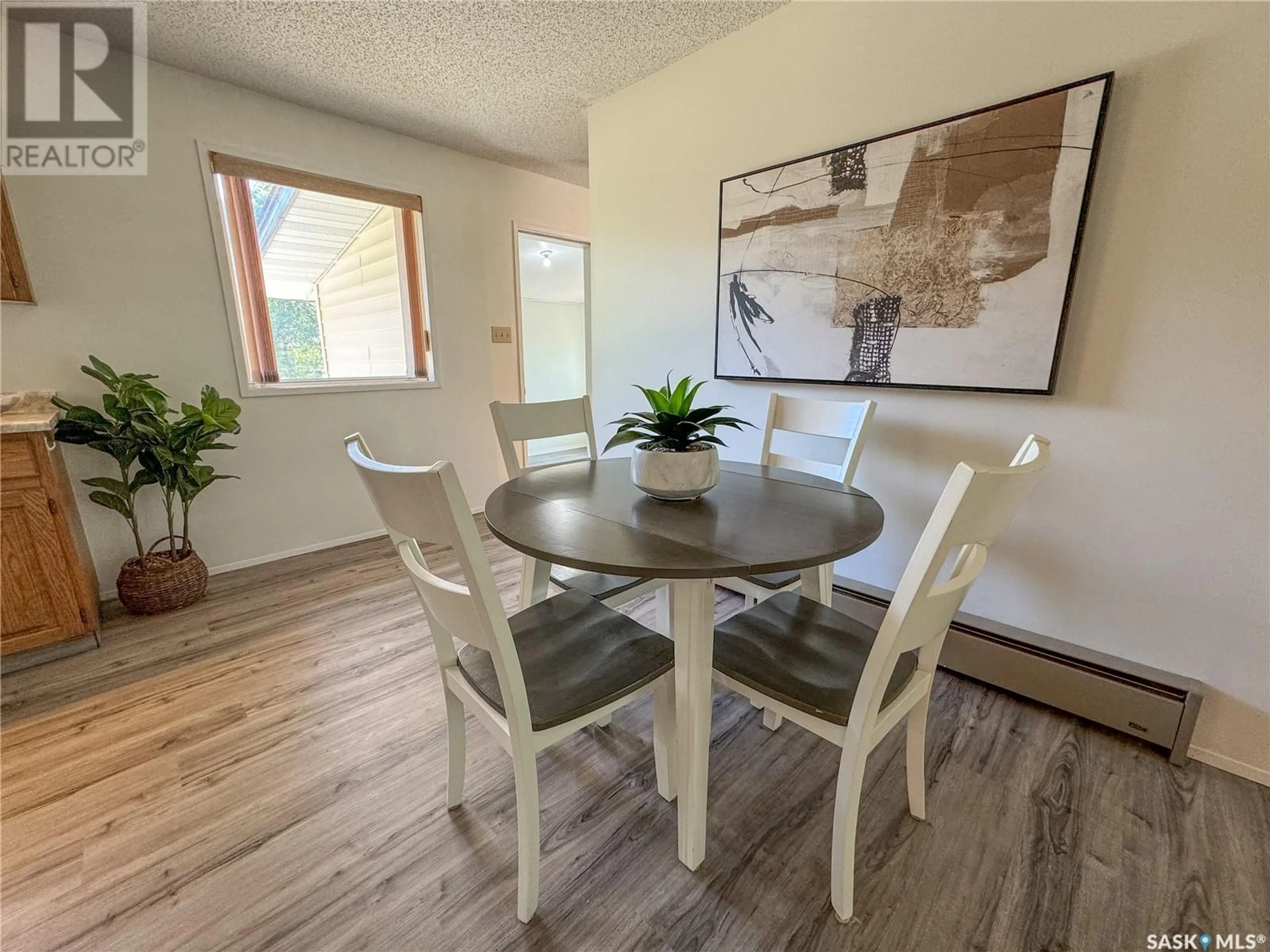 Dining room, wood/laminate floor for 100 EBENAL WAY, Mclean Saskatchewan S0G3E0