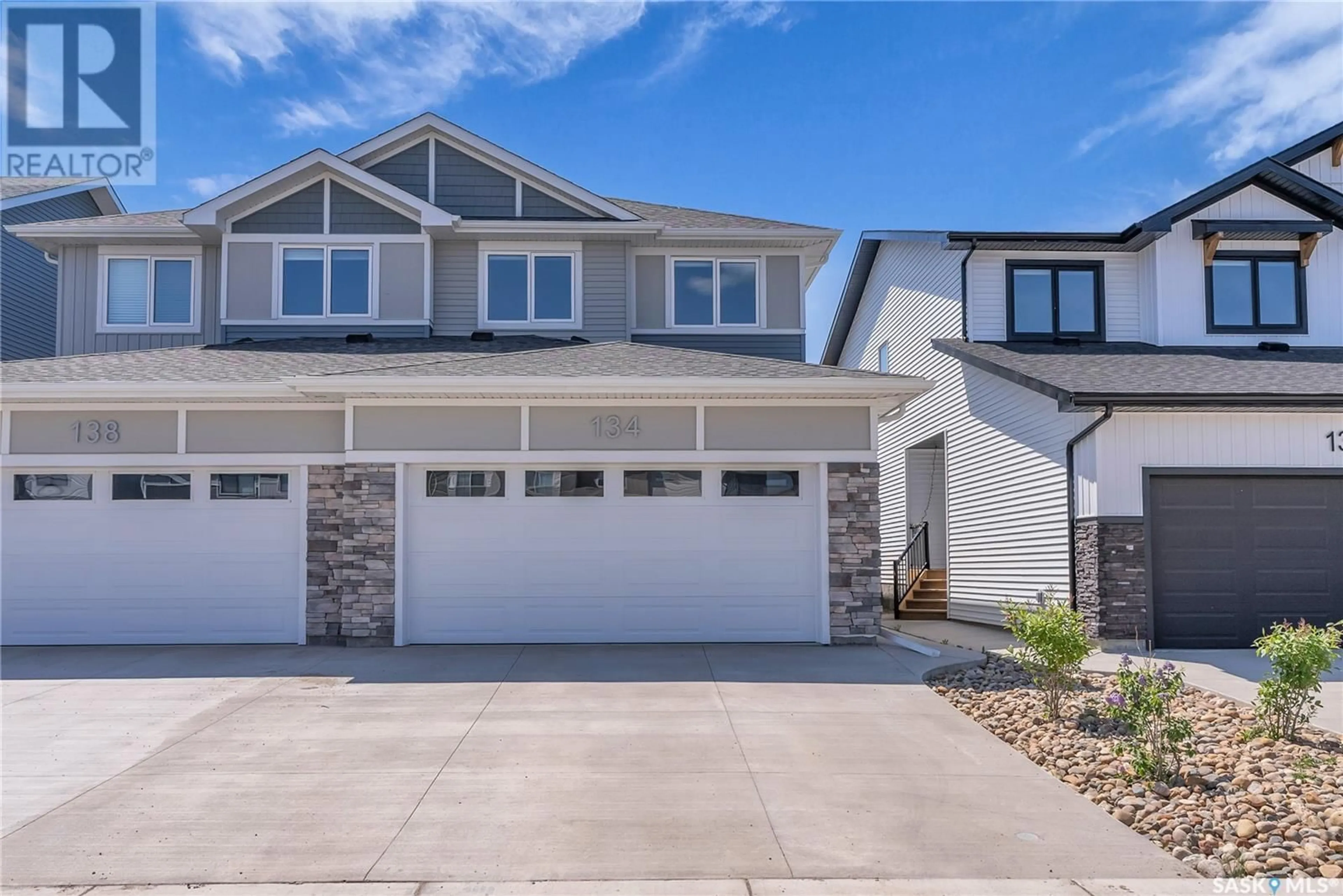 Home with vinyl exterior material, street for 134 COWESSESS ROAD, Saskatoon Saskatchewan S7V1S3