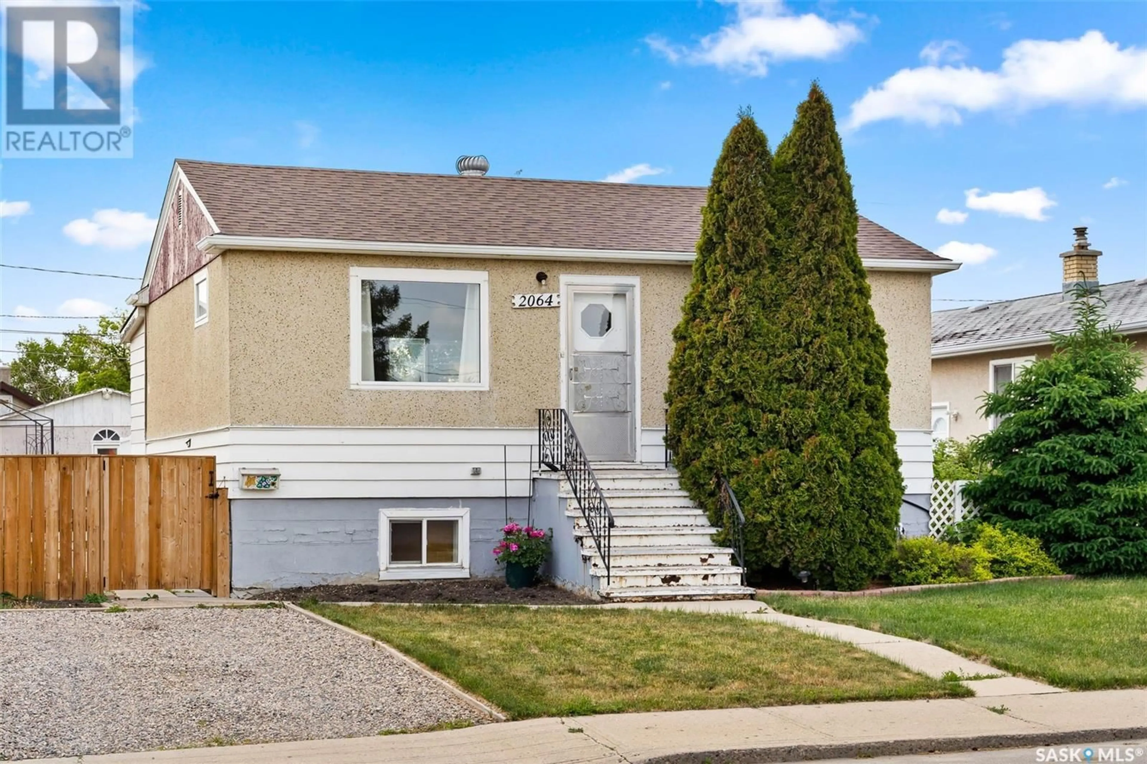 Home with vinyl exterior material, street for 2064 HARVEY STREET, Regina Saskatchewan S4N2M7