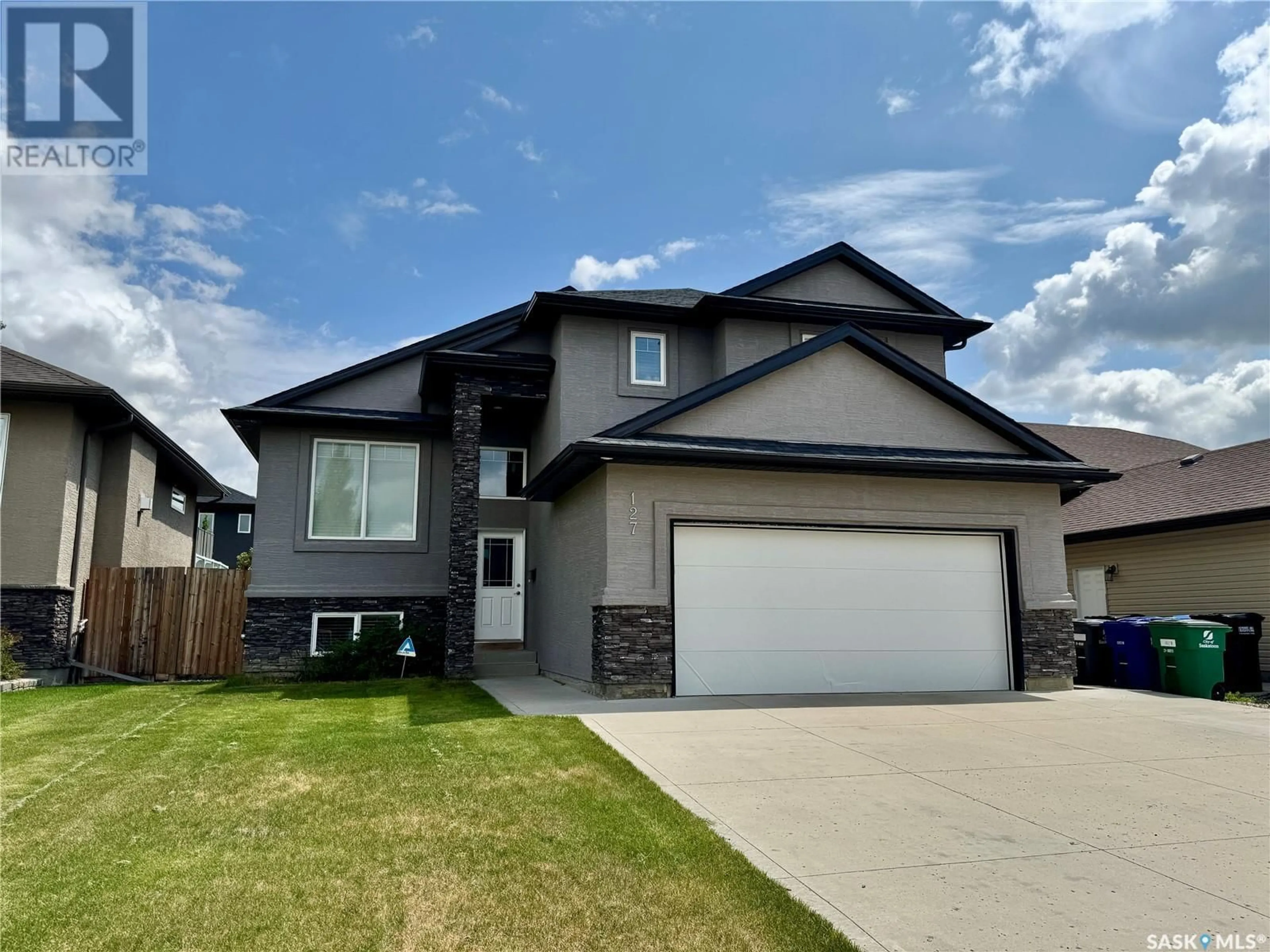 Home with vinyl exterior material, street for 127 ATTON CRESCENT, Saskatoon Saskatchewan S7W0K8
