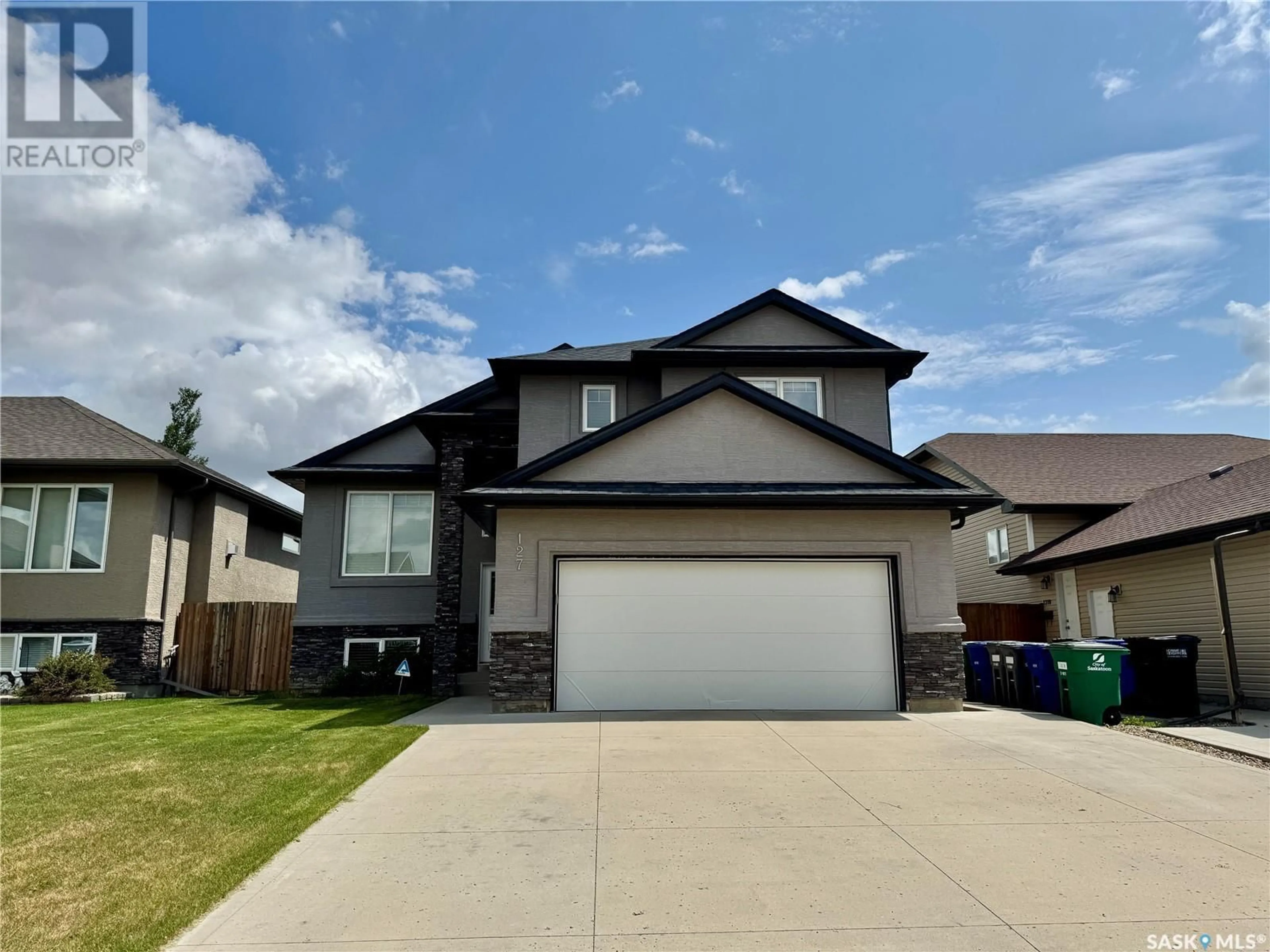 Home with vinyl exterior material, street for 127 ATTON CRESCENT, Saskatoon Saskatchewan S7W0K8