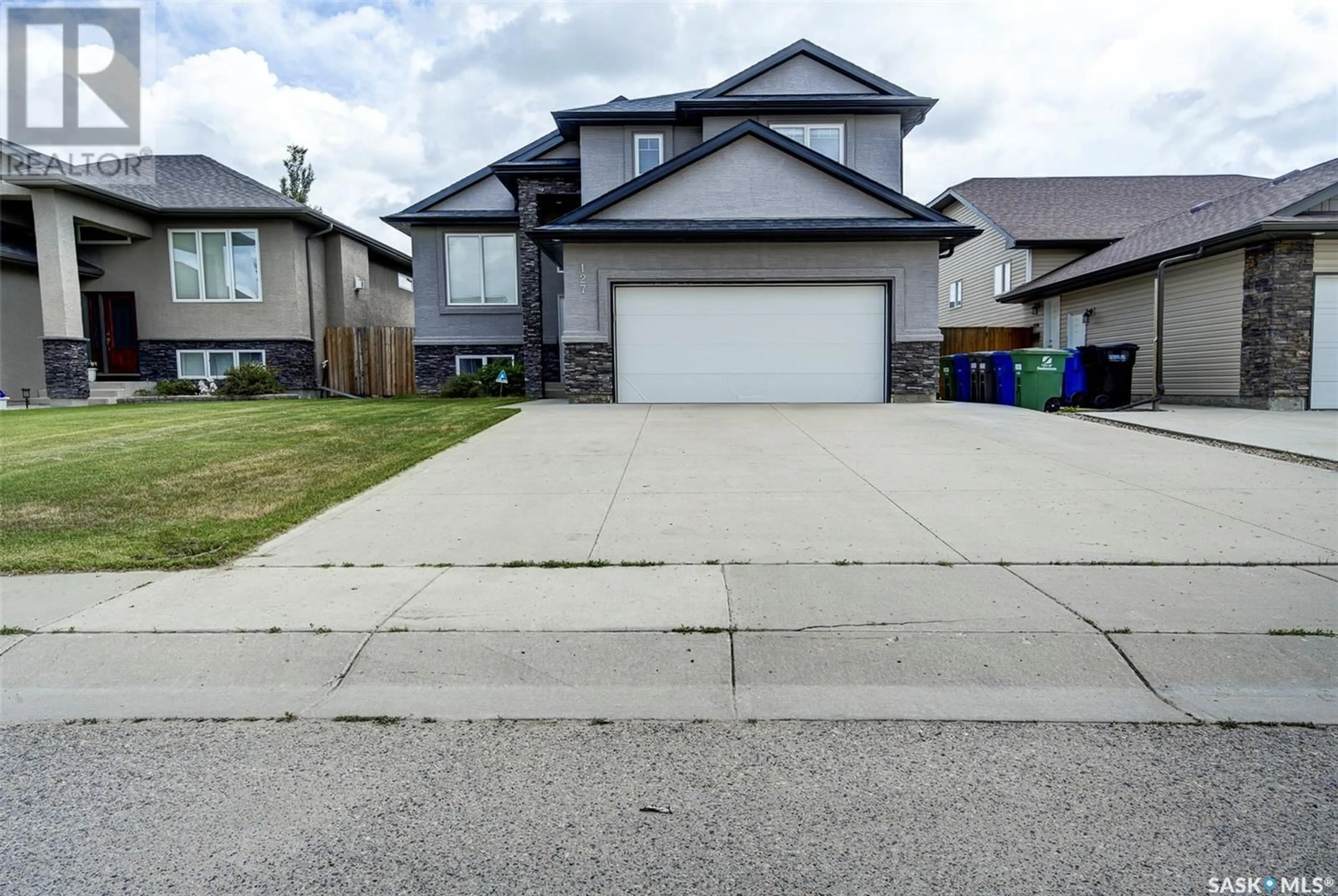 Home with vinyl exterior material, street for 127 ATTON CRESCENT, Saskatoon Saskatchewan S7W0K8