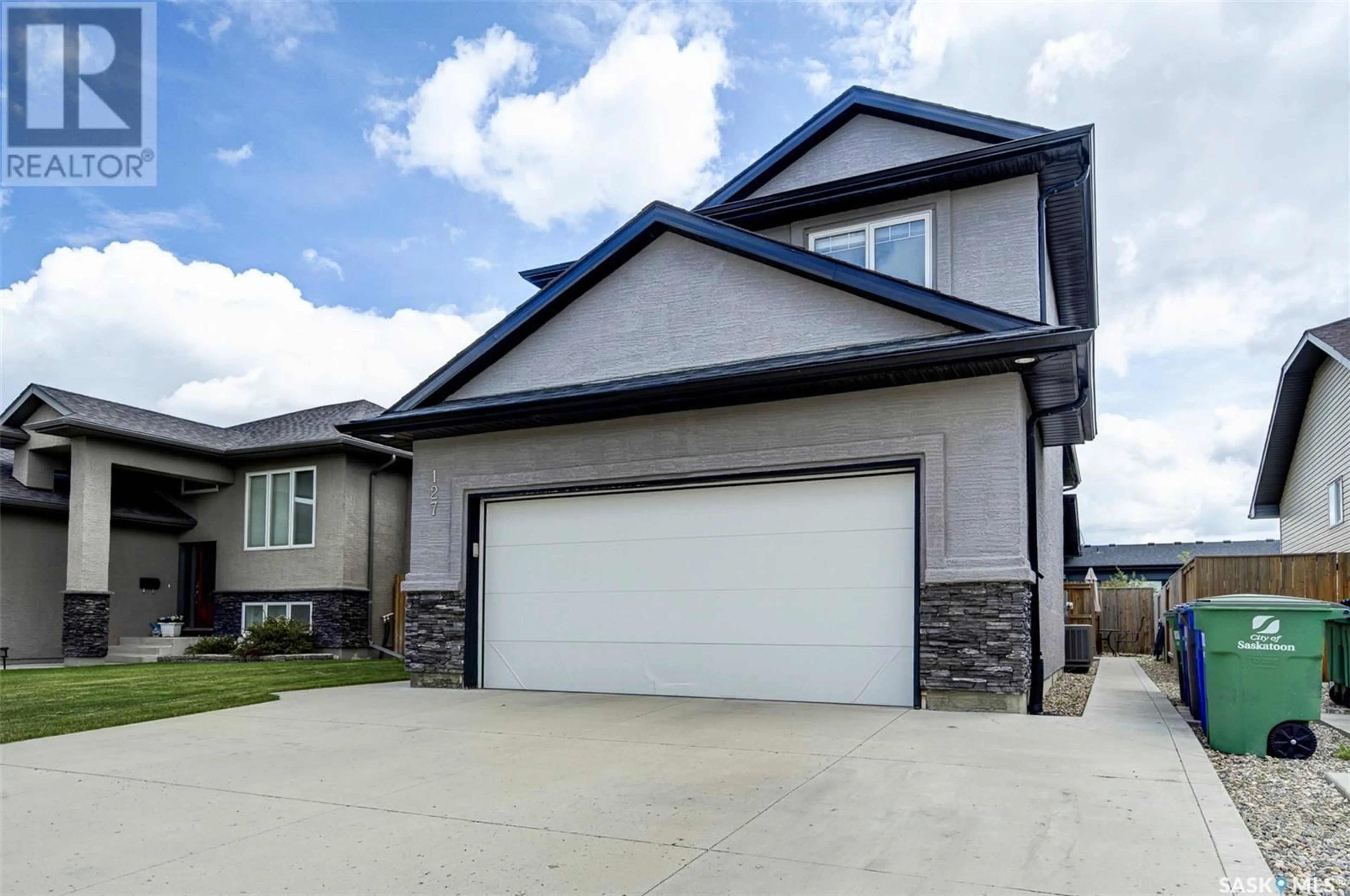 Home with vinyl exterior material, street for 127 ATTON CRESCENT, Saskatoon Saskatchewan S7W0K8