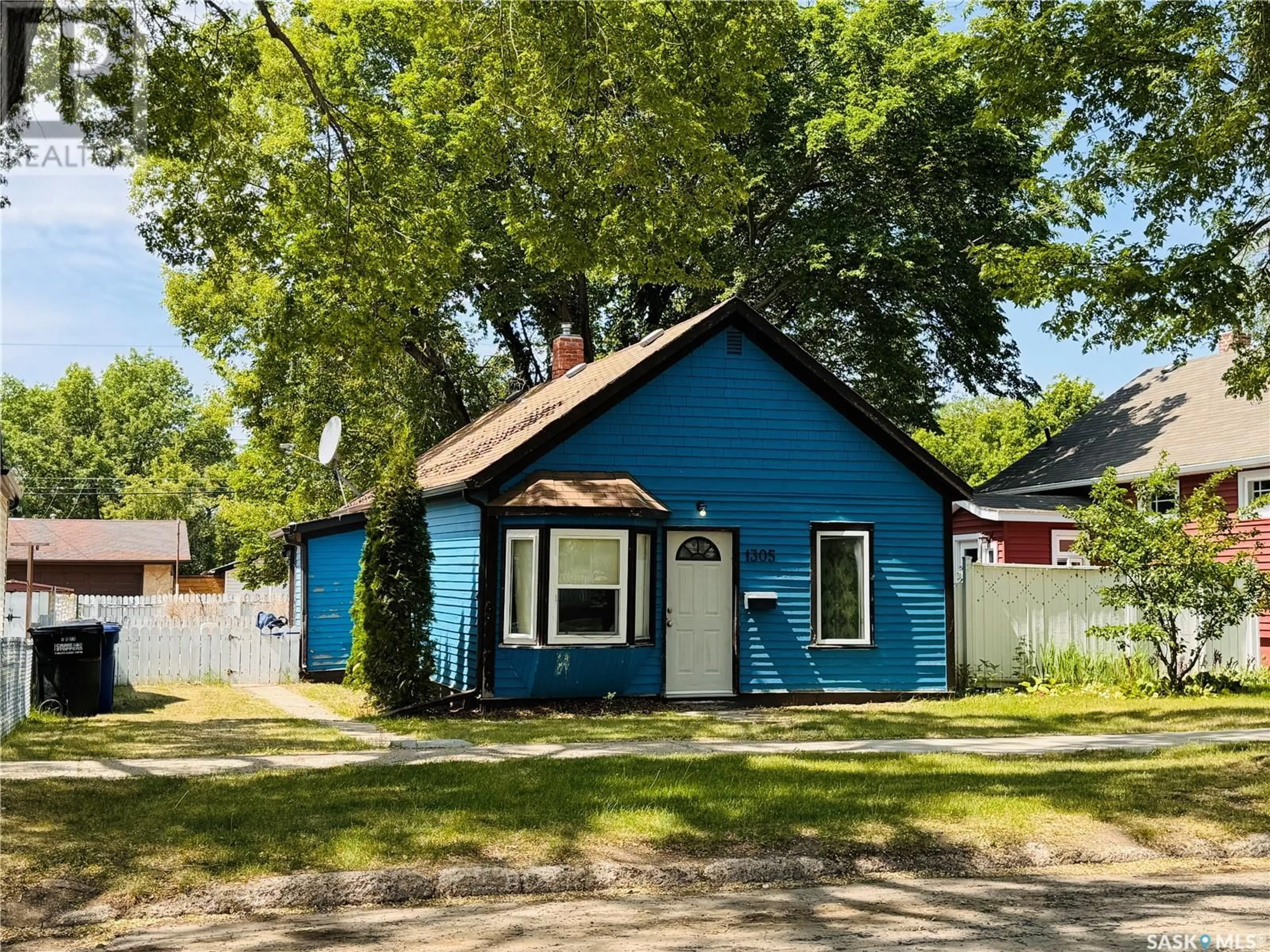 Home with vinyl exterior material, street for 1305 G AVENUE, Saskatoon Saskatchewan S7L2A6