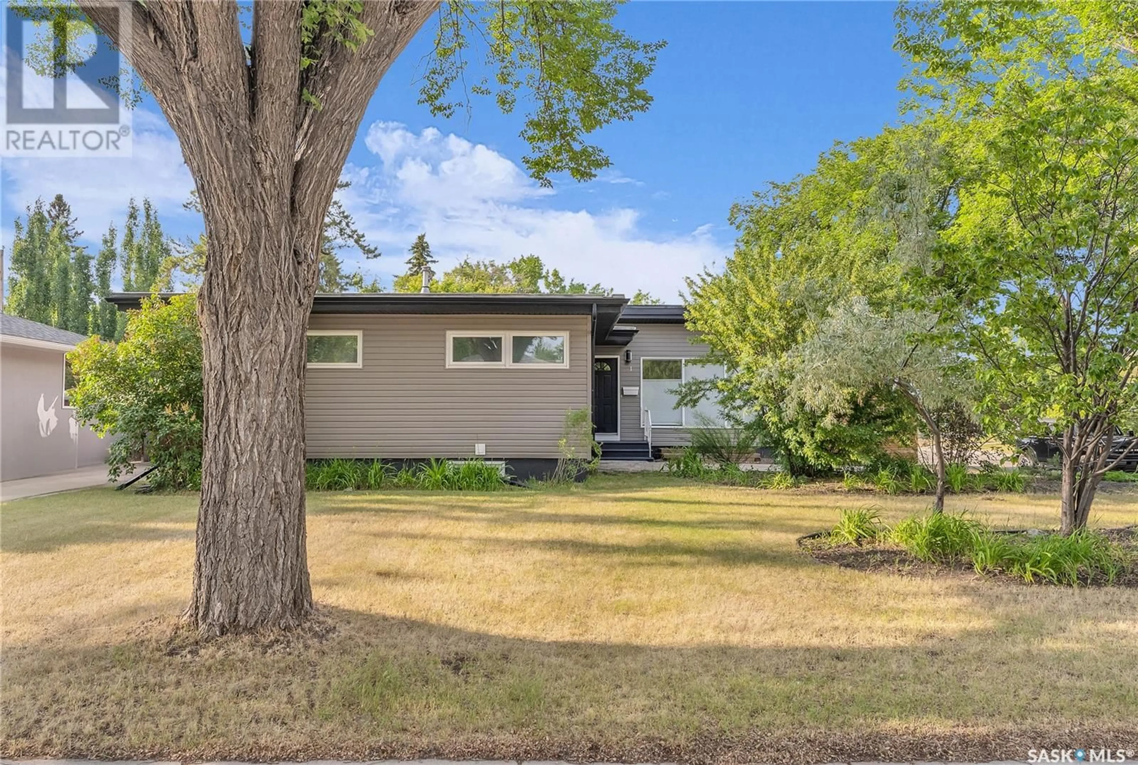 Home with vinyl exterior material, street for 1 SULLIVAN STREET, Saskatoon Saskatchewan S7H3G7