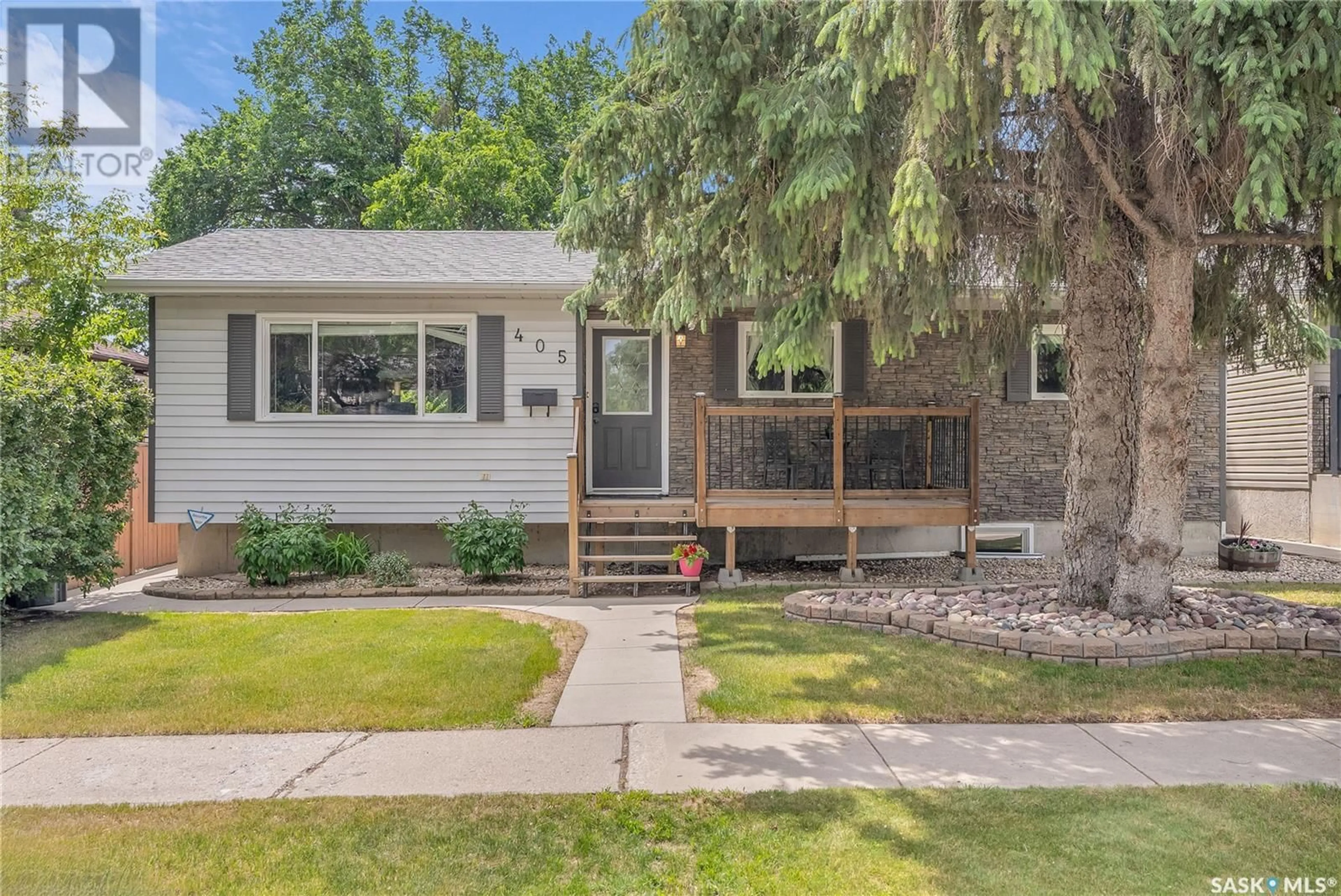 Home with vinyl exterior material, street for 405 110TH STREET, Saskatoon Saskatchewan S7N1S6
