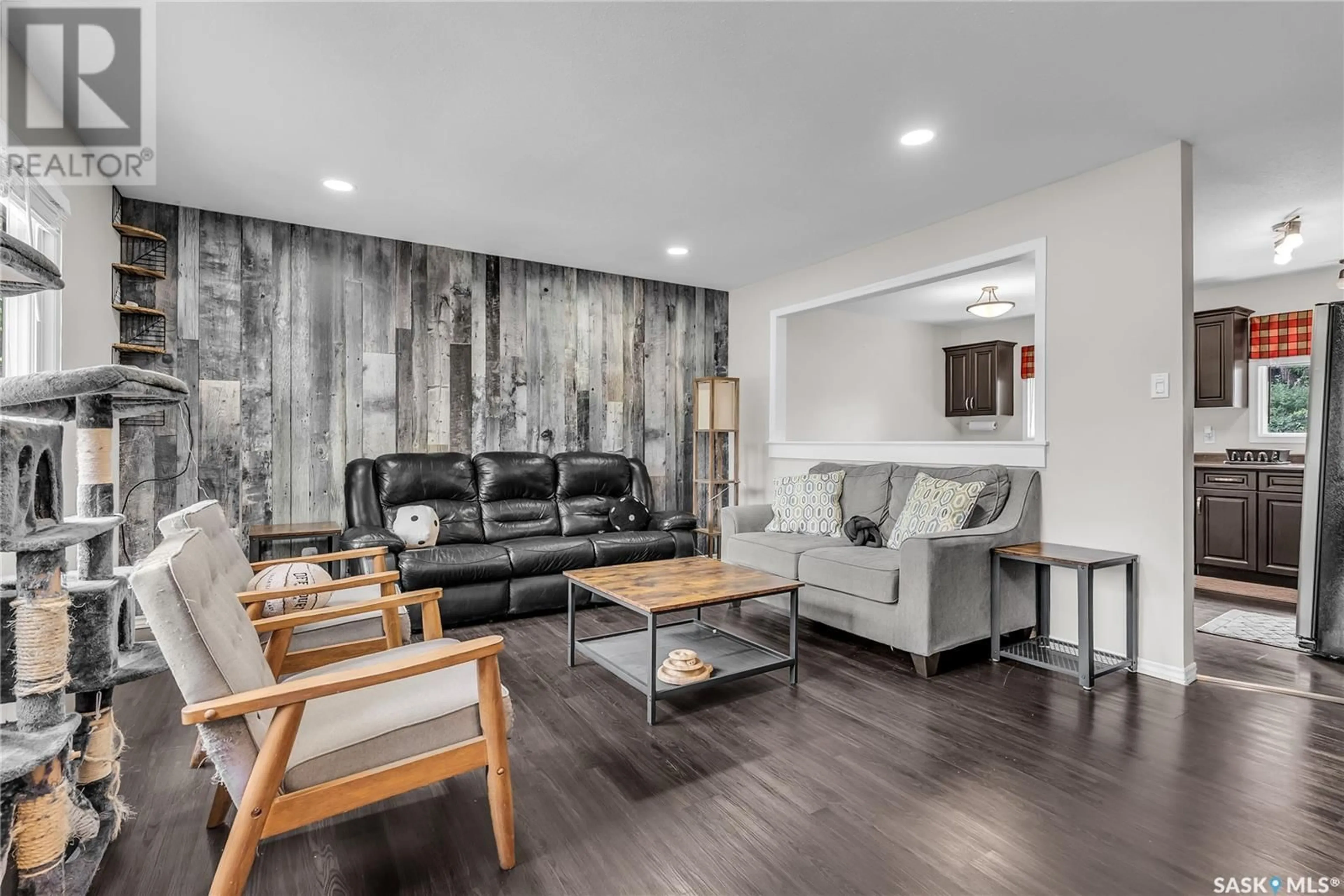 Living room with furniture, wood/laminate floor for 405 110TH STREET, Saskatoon Saskatchewan S7N1S6
