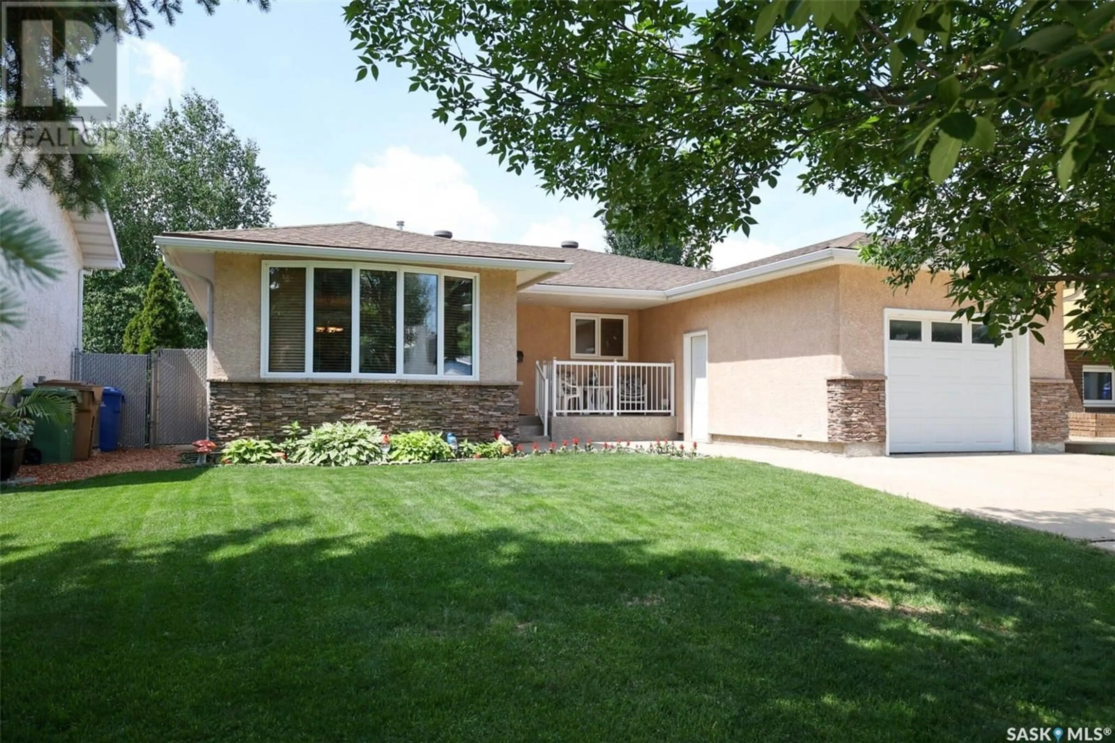 Home with brick exterior material, street for 14 DUNSMORE DRIVE, Regina Saskatchewan S4R7G2