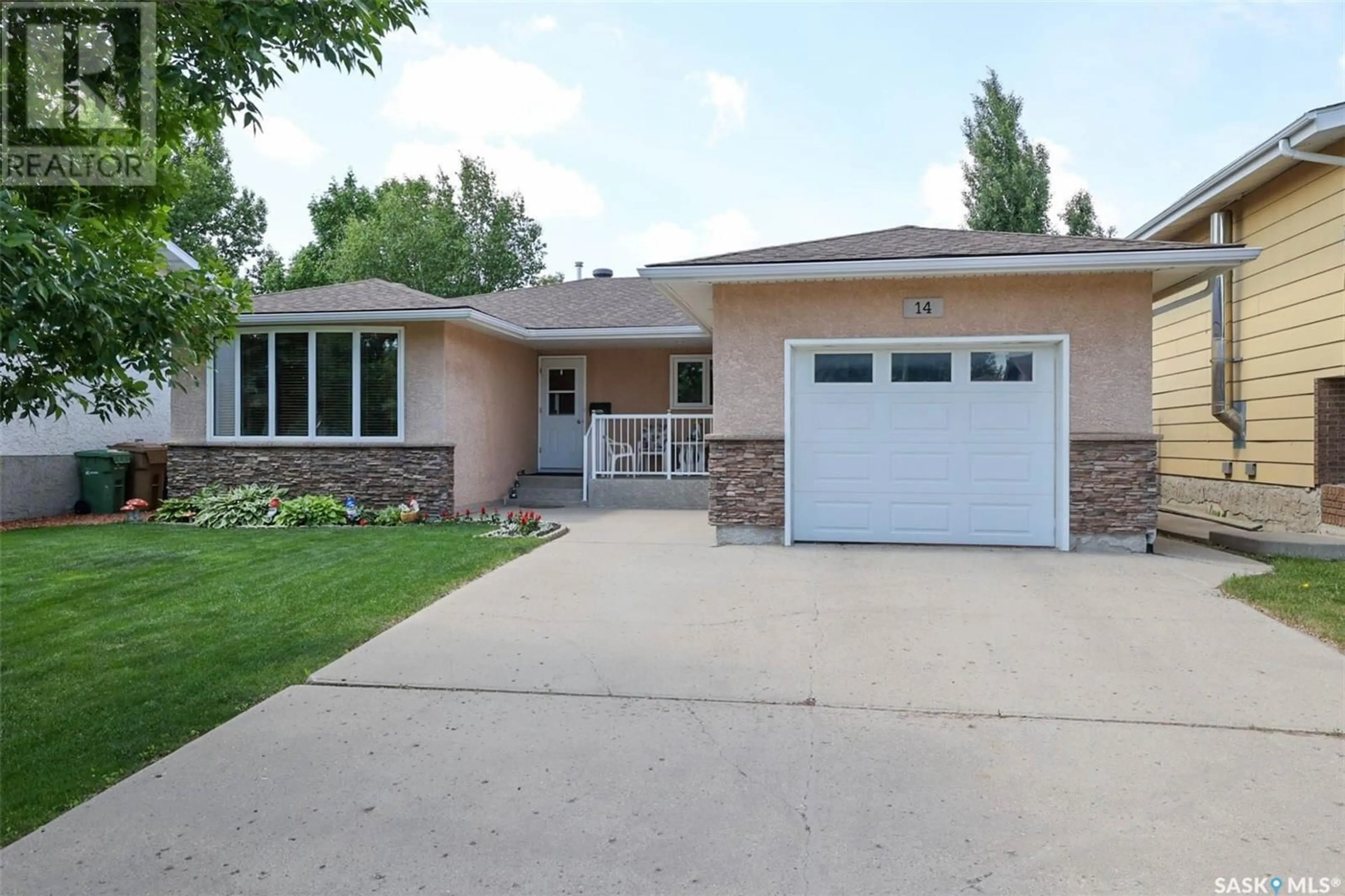 Home with vinyl exterior material, street for 14 DUNSMORE DRIVE, Regina Saskatchewan S4R7G2