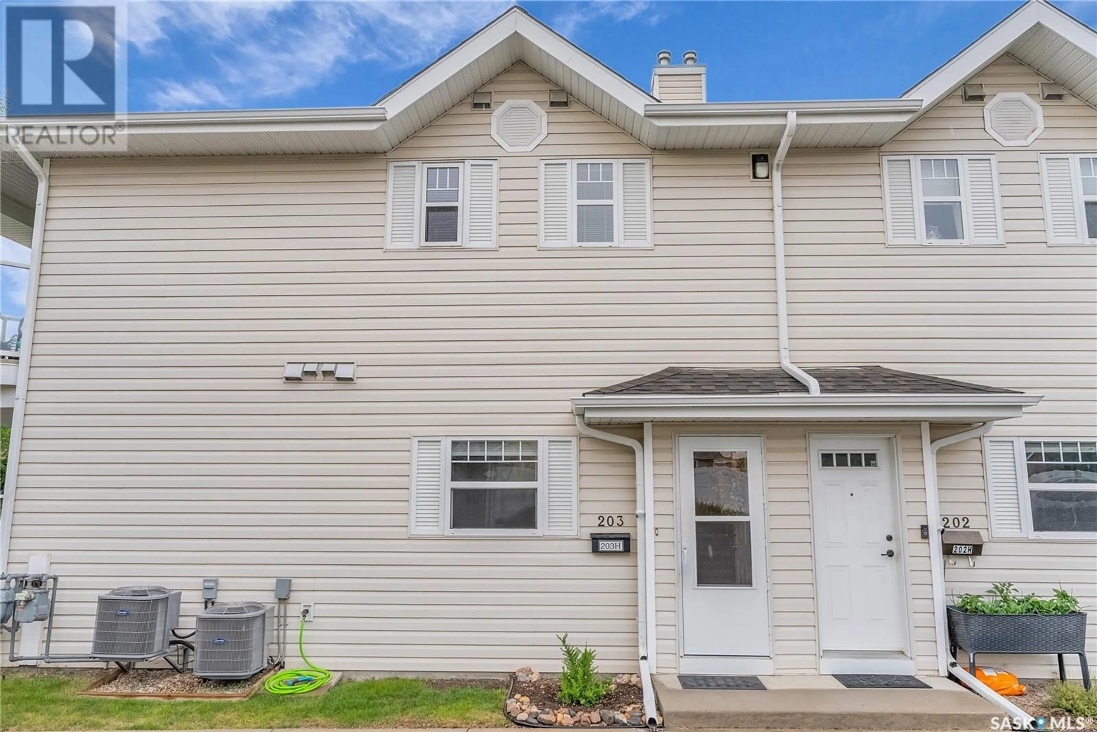 Home with vinyl exterior material, street for 105th W - 203H 141 STREET, Saskatoon Saskatchewan S7N1N3