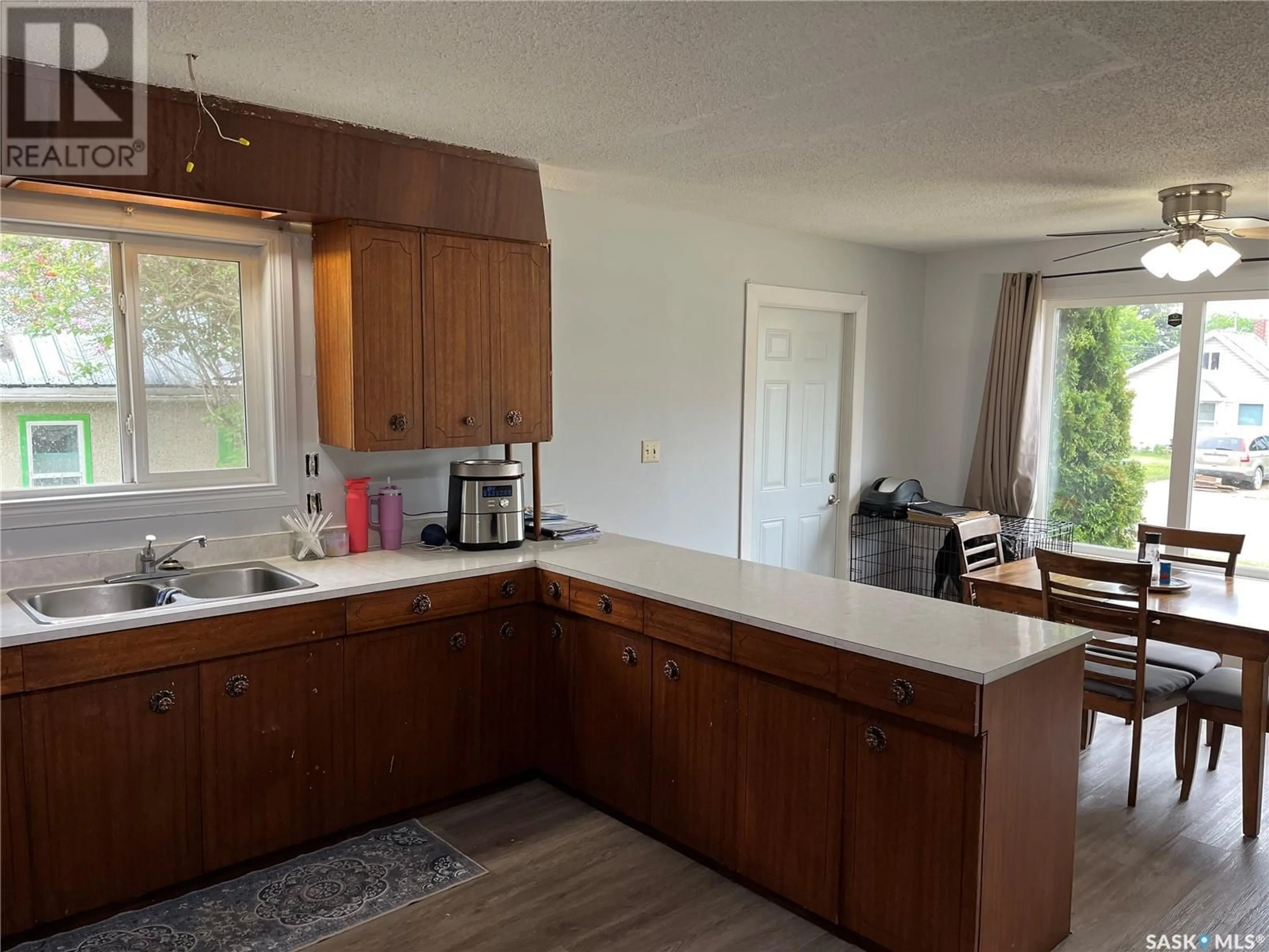 Open concept kitchen, wood/laminate floor for 706 6TH STREET, Prince Albert Saskatchewan S6V0N8