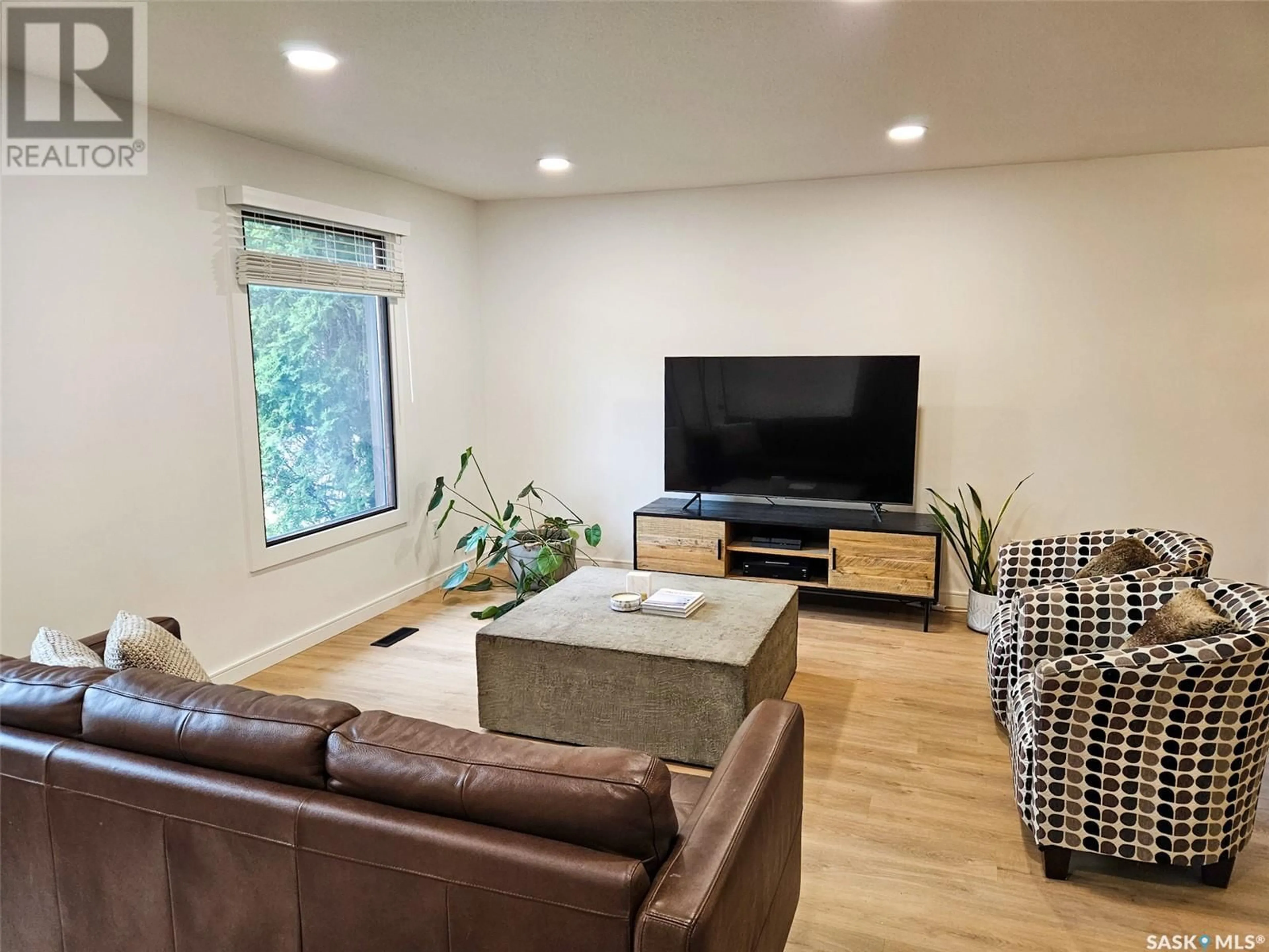 Living room with furniture, wood/laminate floor for 334 POWELL CRESCENT, Swift Current Saskatchewan S9H4L7