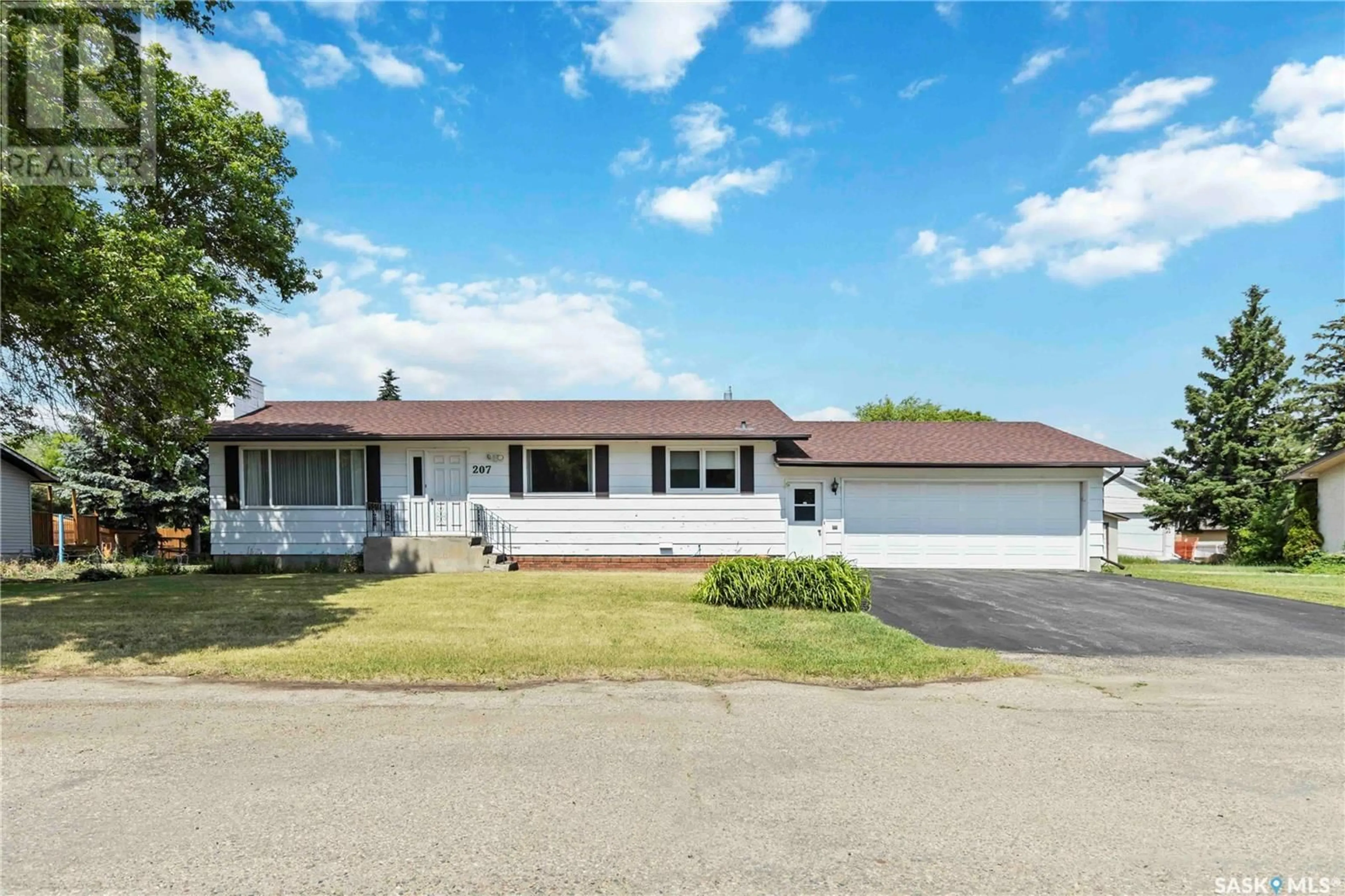Home with vinyl exterior material, street for 207 1ST AVENUE, Vanscoy Saskatchewan S0L3J0