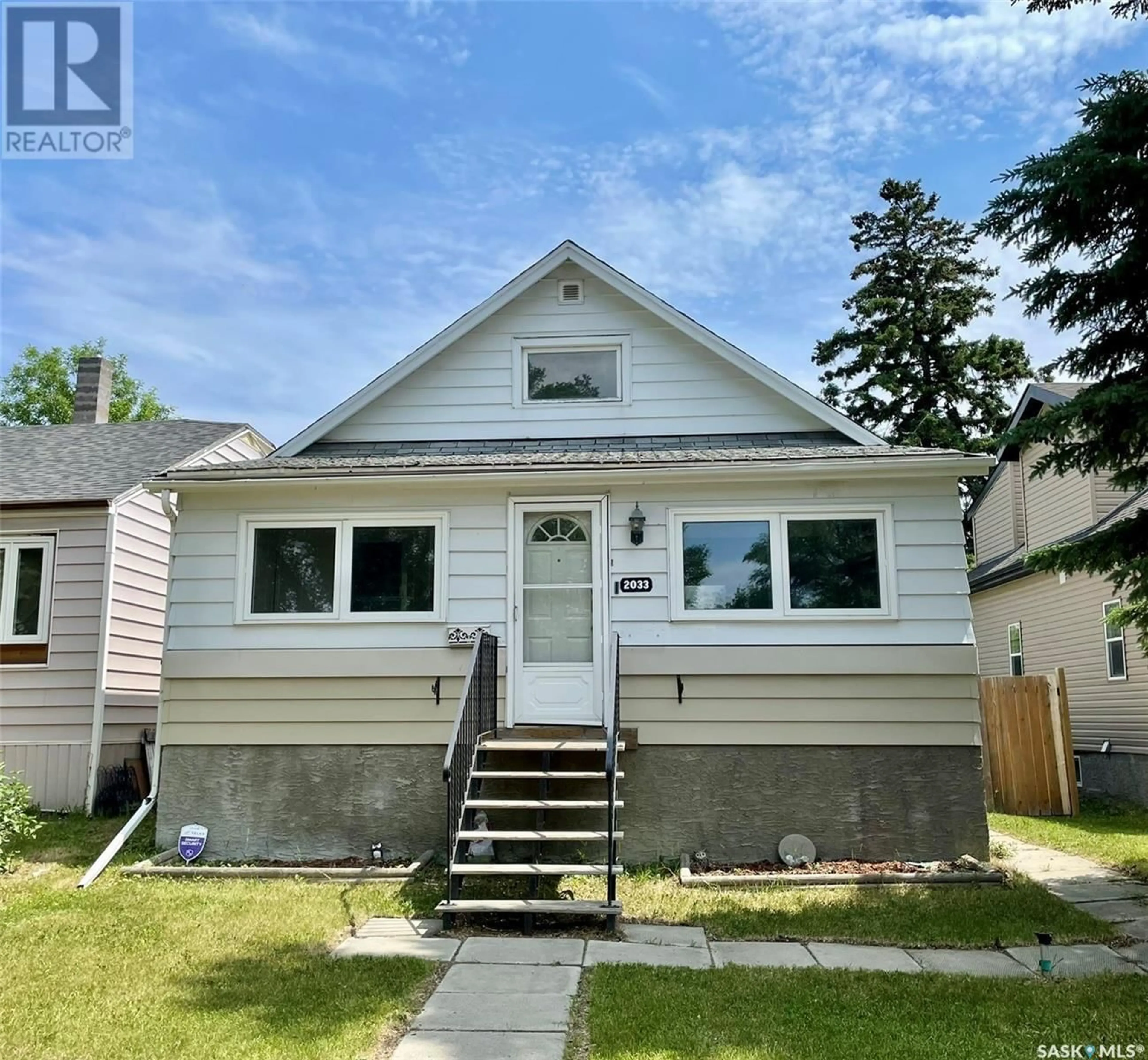 Home with vinyl exterior material, street for 2033 ATKINSON STREET, Regina Saskatchewan S4N3W8