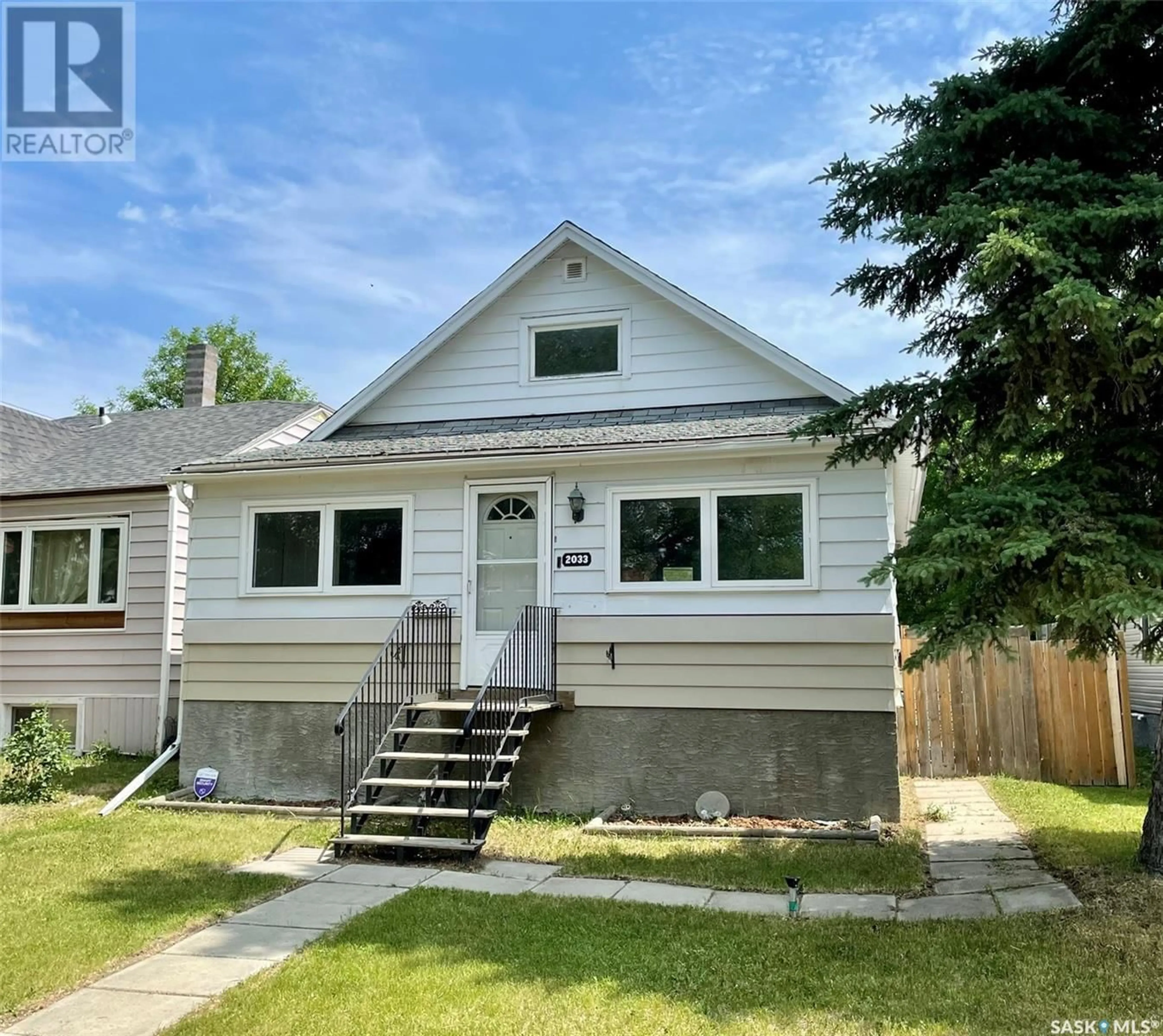 Home with vinyl exterior material, street for 2033 ATKINSON STREET, Regina Saskatchewan S4N3W8