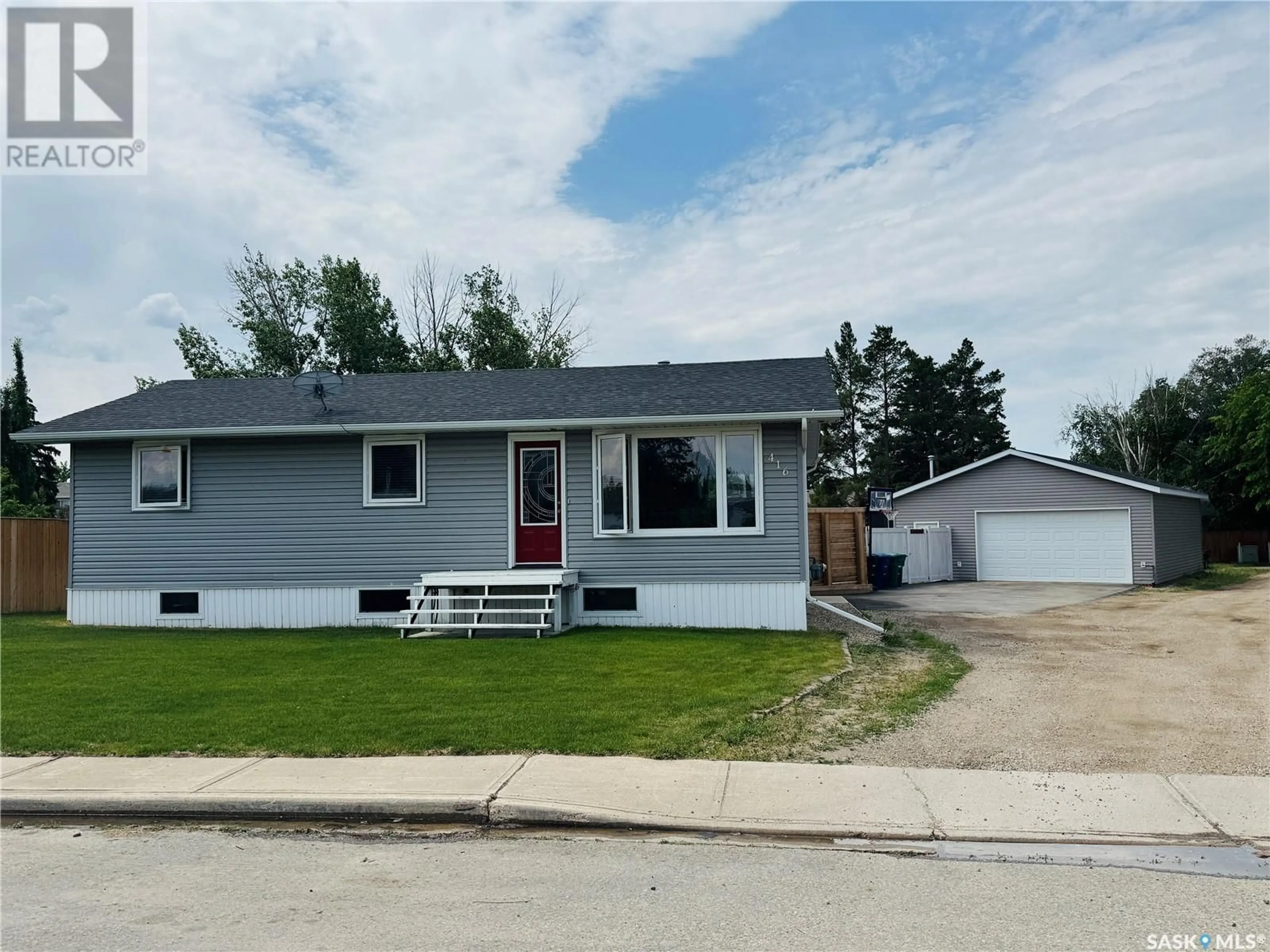 Home with vinyl exterior material, street for 416 6TH AVENUE, Biggar Saskatchewan S0K0M0