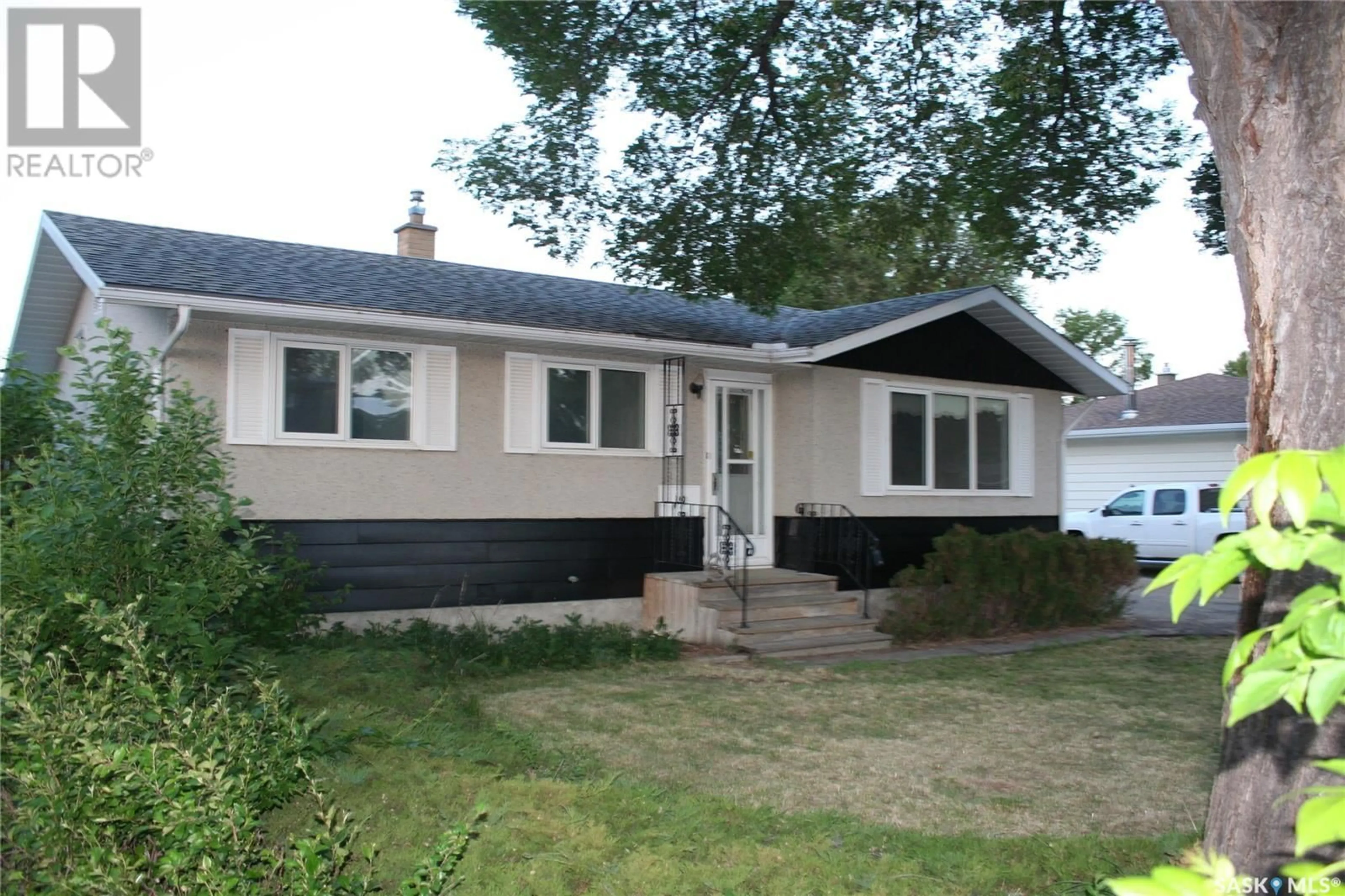 Home with vinyl exterior material, street for 19 MERLIN CRESCENT, Regina Saskatchewan S4R3E7