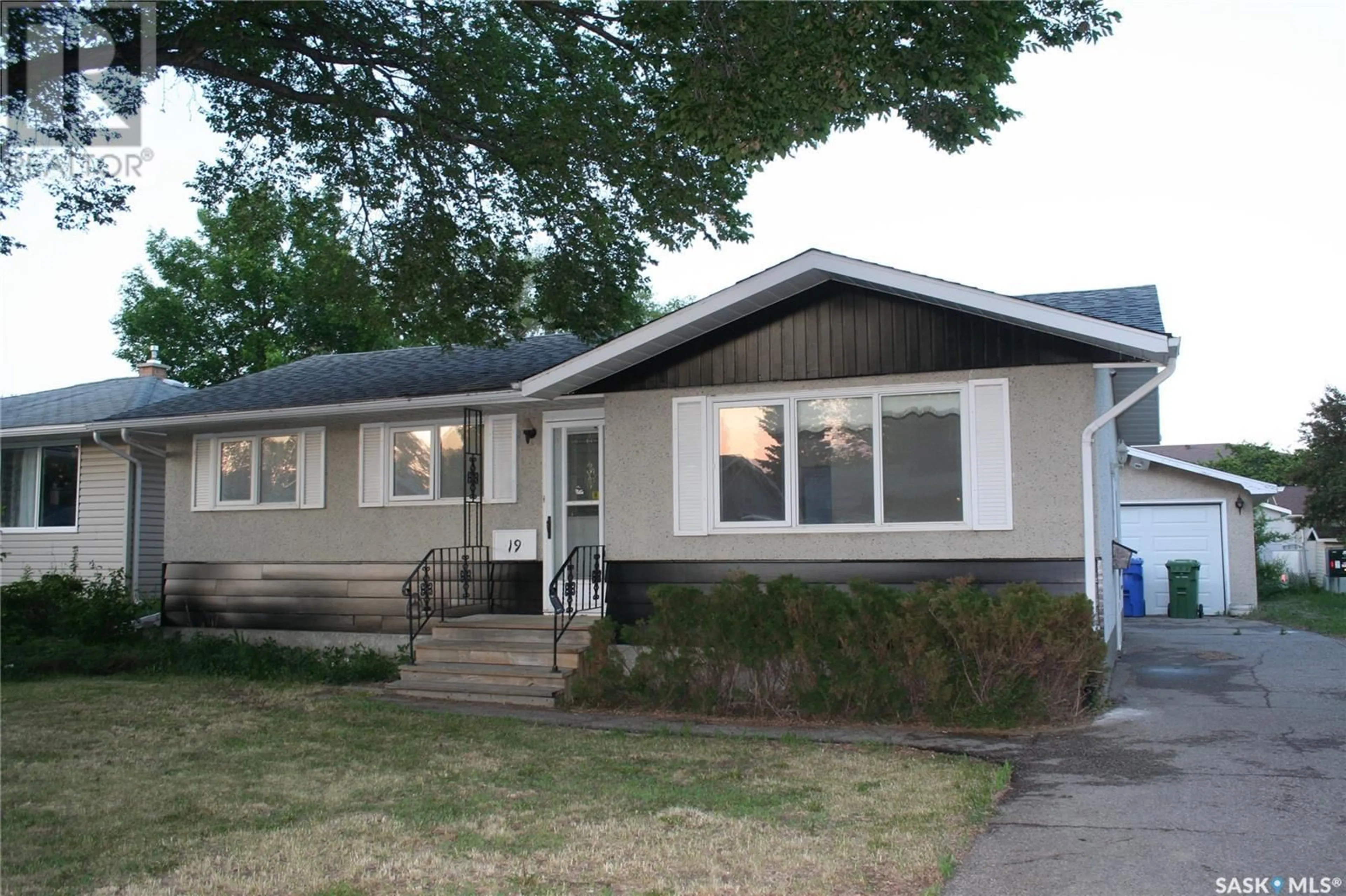 Home with vinyl exterior material, street for 19 MERLIN CRESCENT, Regina Saskatchewan S4R3E7