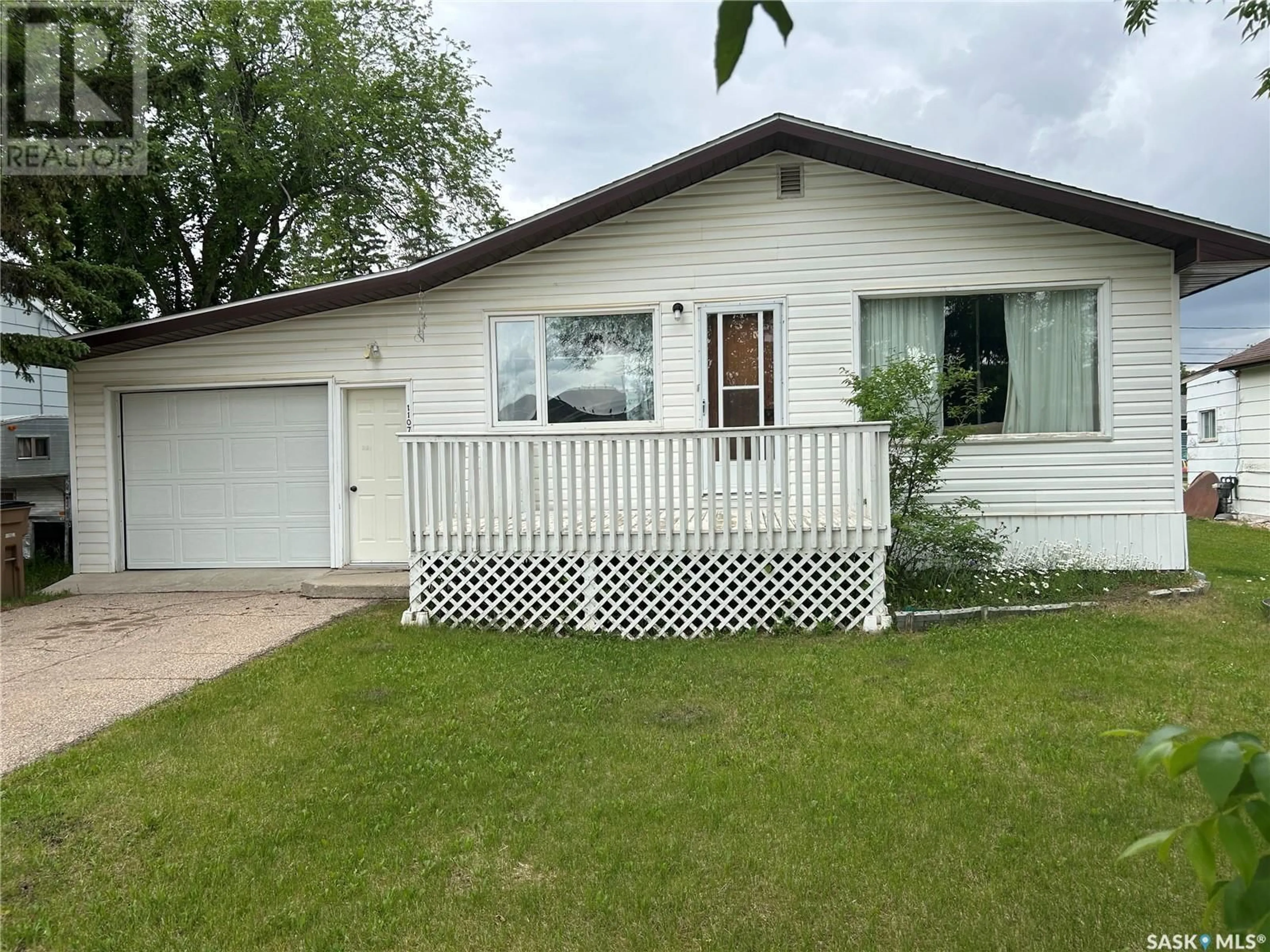 Home with vinyl exterior material, street for 1107 95TH STREET, Tisdale Saskatchewan S0E1T0