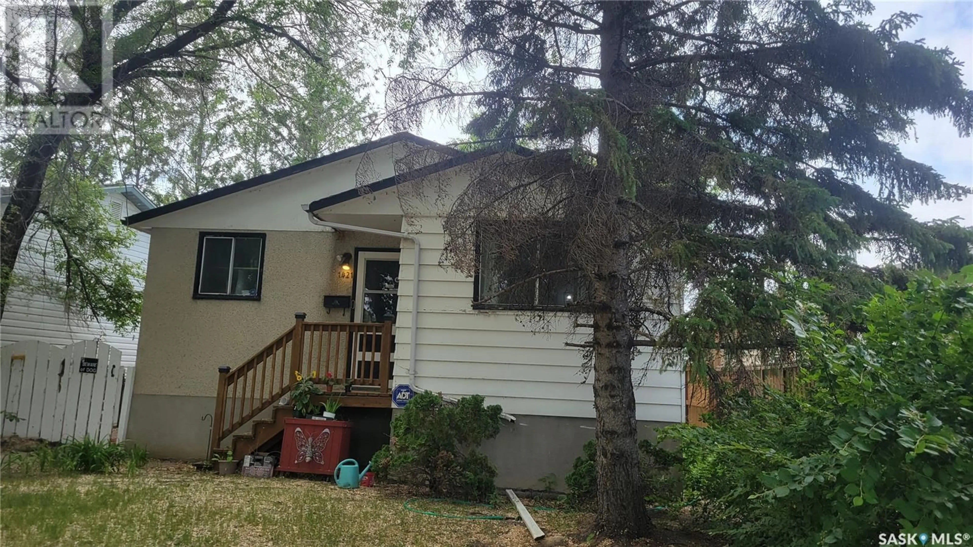 Home with vinyl exterior material, street for 1421 HNATYSHYN AVENUE, Saskatoon Saskatchewan S7L4G6