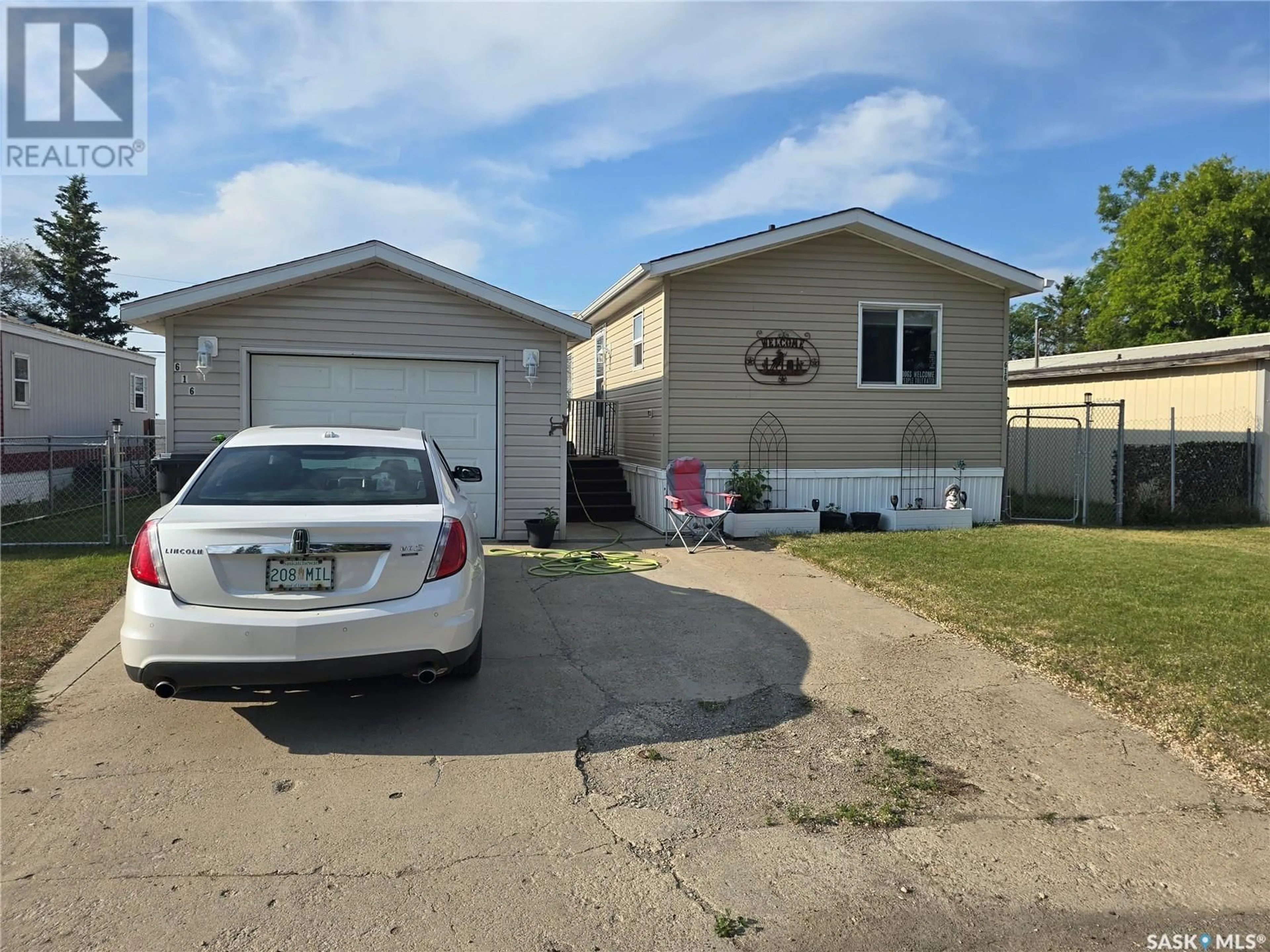 Home with vinyl exterior material, street for E - 616 LITTLE QUILL AVENUE, Wynyard Saskatchewan S0A4T0