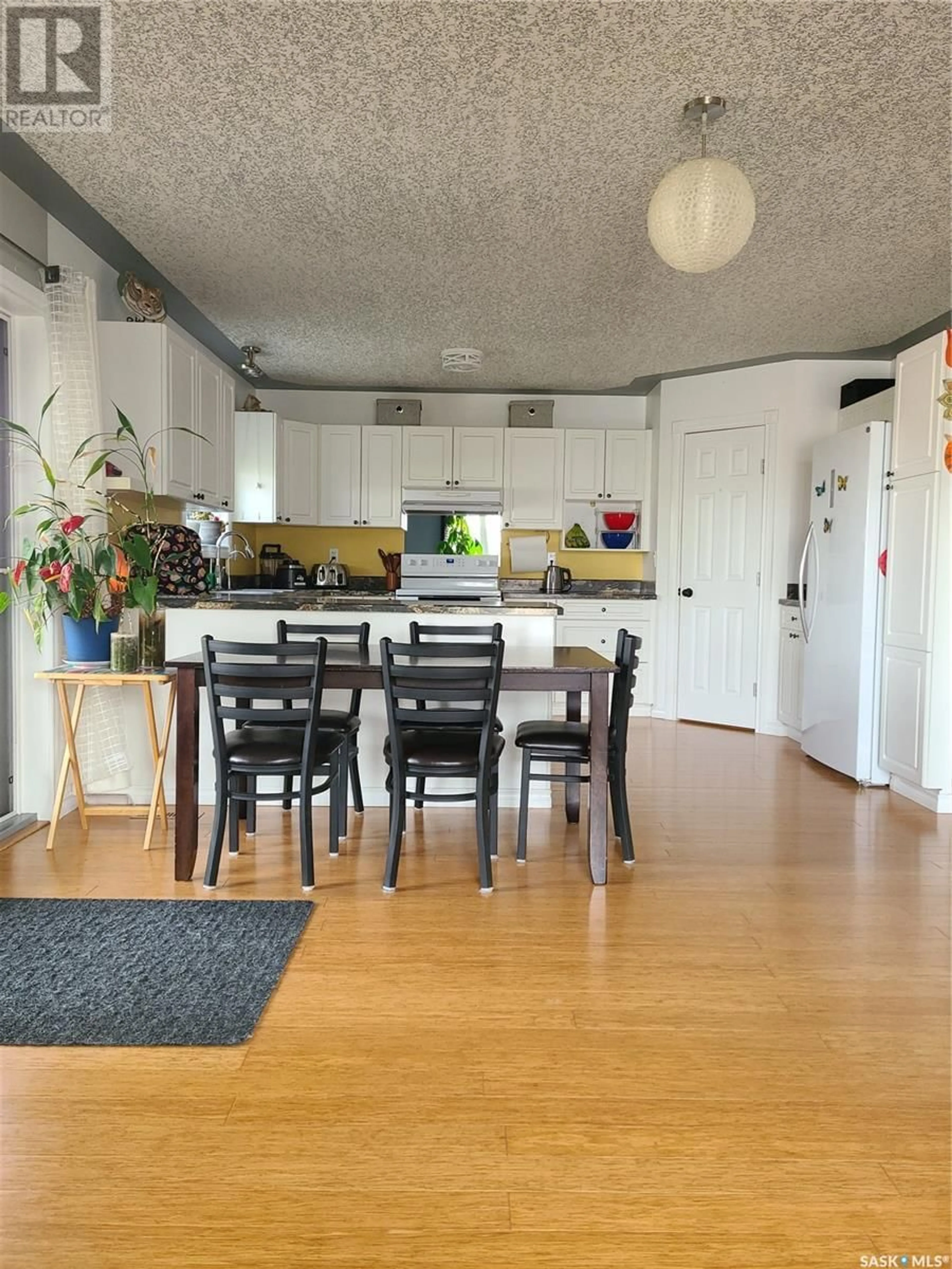 Open concept kitchen, wood/laminate floor for 48 WHITEWATER PLACE, Yorkton Saskatchewan S3N0X1